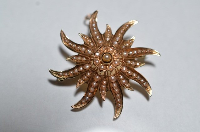EDWARDIAN GOLD & PEARL STAR BURST PIN: - 14k yellow gold star burst set with seed pearls, with pin and pendant, 5 grams.