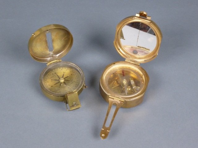 TWO BRASS POCKET COMPASSES BY STANLEY, LONDON: - The first is a dry magnetic portable compass. The second a surveyor's compass with a built in mirror; bears serial # 1784. Dry compass measures 5.39 x 6.98 x 8.89 cm (2 1/8 x 2 3/4 x 3 1/2 in). Prov