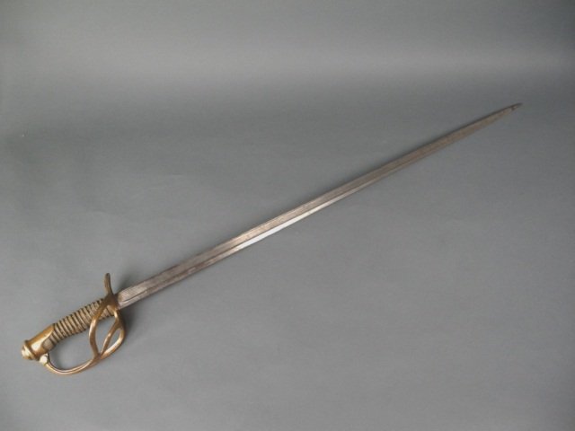 DRESS SWORD: - marked Mce Meyer in script at blade, just above guard. Carved wooden grip with cast brass hilt and pommel. Overall L 100.9 cm. (39 3/4 in.). L of blade: 86.36 cm. (34 in.).