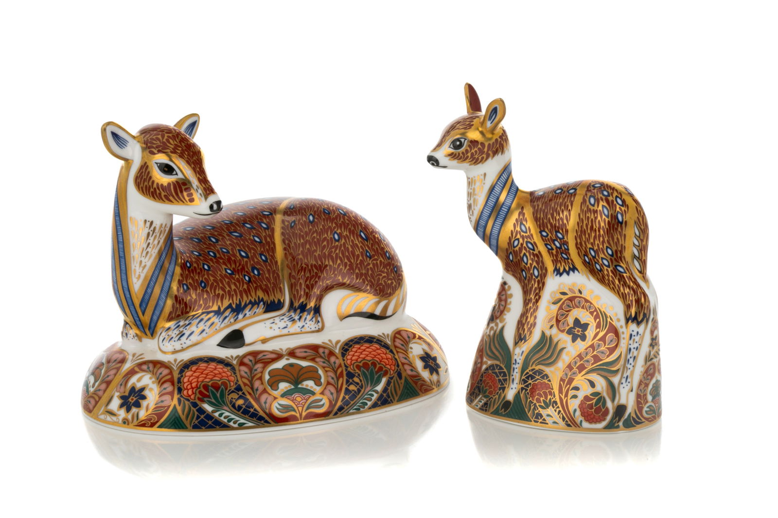 ROYAL CROWN DERBY FAWN AND DEER PAPERWEIGHTS: Pair of Royal Crown Derby paperweights, one a fawn and the other a deer. Both designed exclusively for the Royal Crown Derby Collector's Guild. Both marked for Royal Crown Derby in red to the undersid