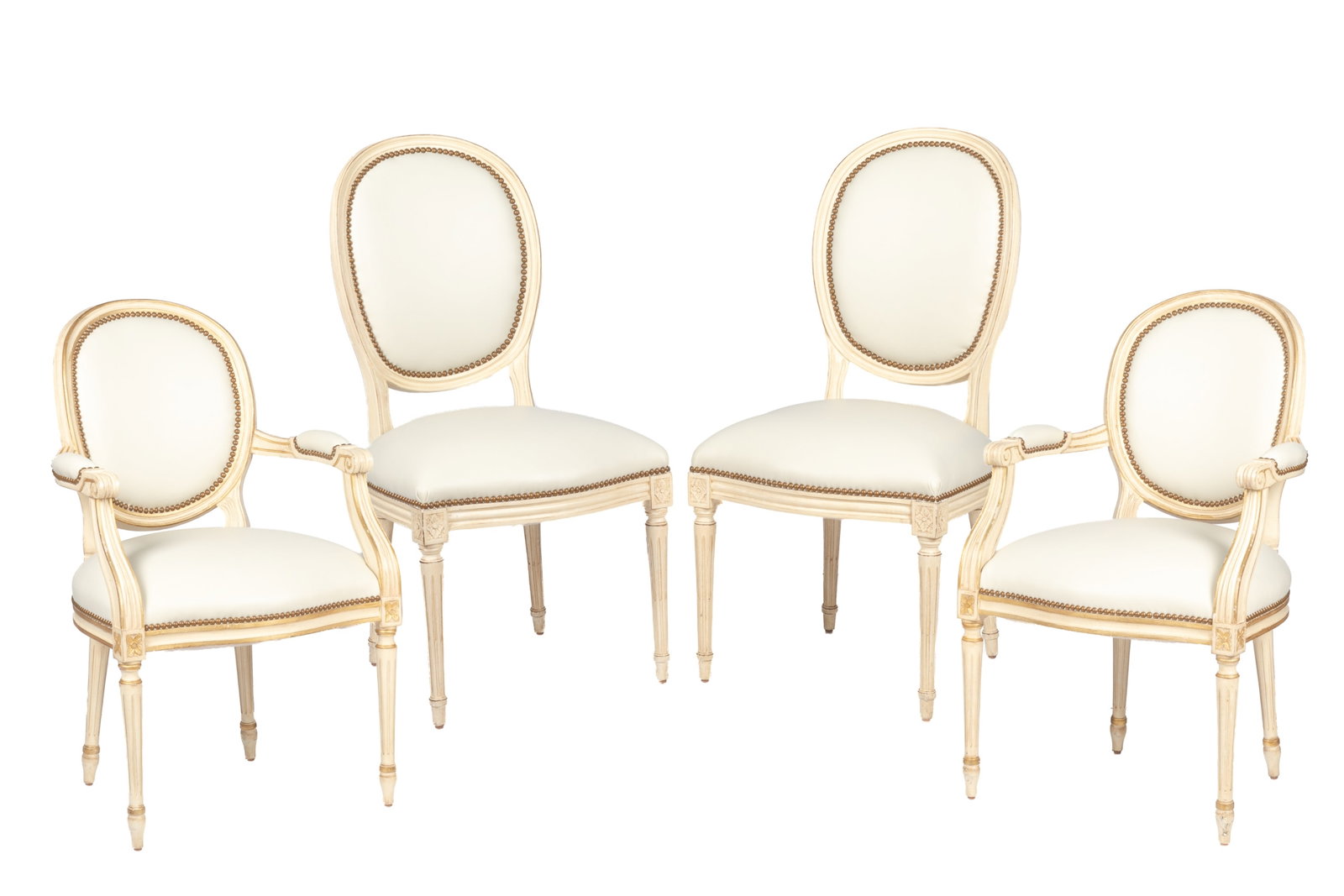 FOUR LEATHER & PAINTED CHAIRS: Cream painted chairs with white leather upholstery and studding.