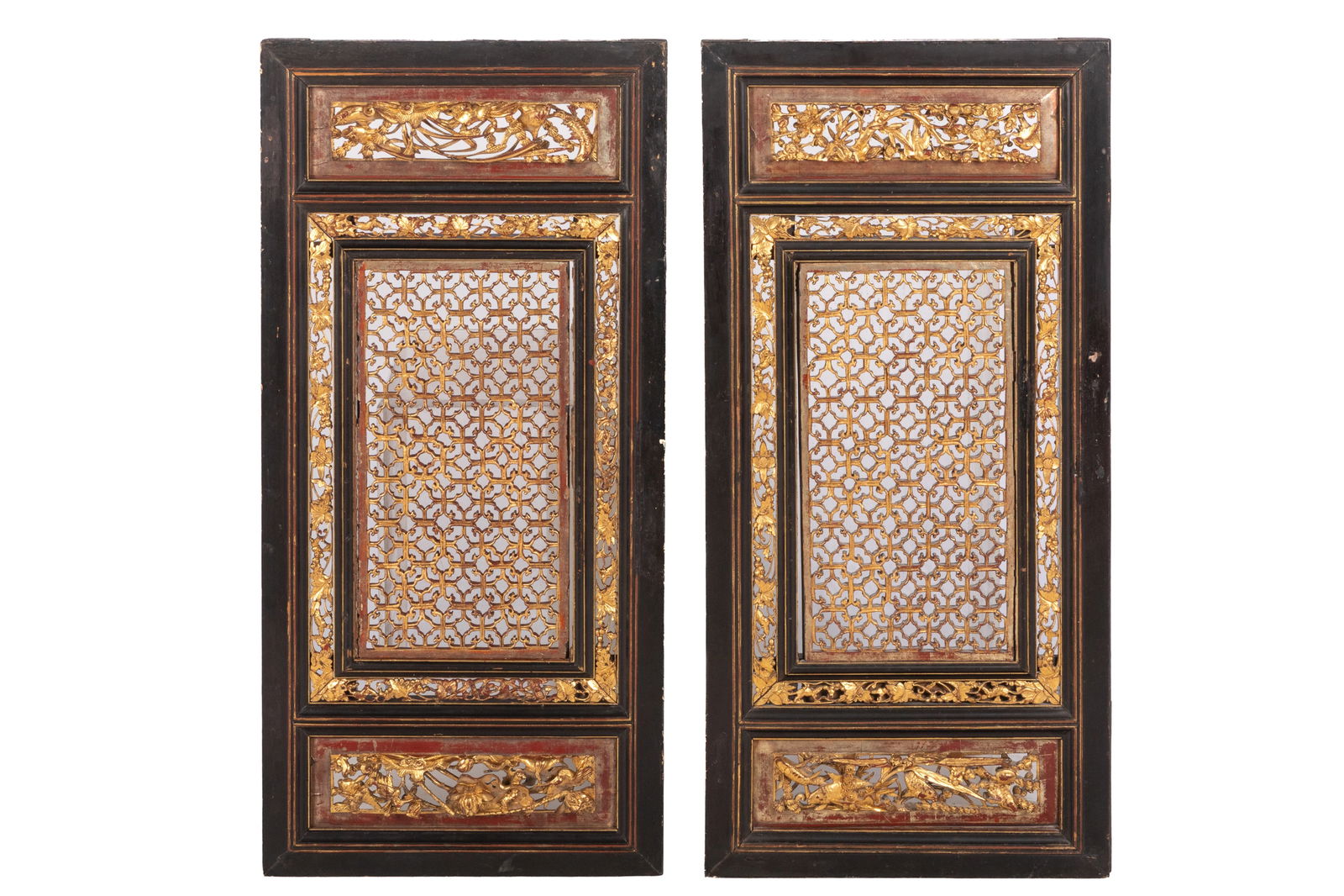PAIR OF GILT LACQUER WINDOW PANELS: Upper register with lotus and cranes, bottom with fish and sea grasses, the central portion of a large intricate lattice bordered in squirrels and grapes, bats and other auspicious symbols, blackwood