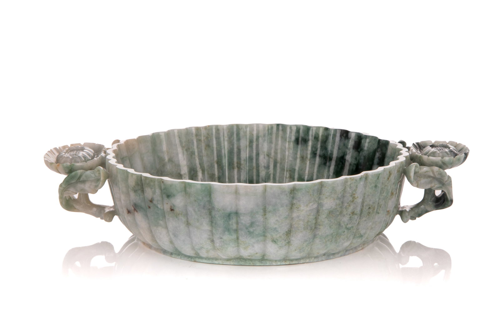 CHINESE JADEITE LOBED MARRIAGE BOWL: A greyish-green stone carved into a multi-lobed bowl, with two chrysanthemum sprig handles. L 9 3/4in