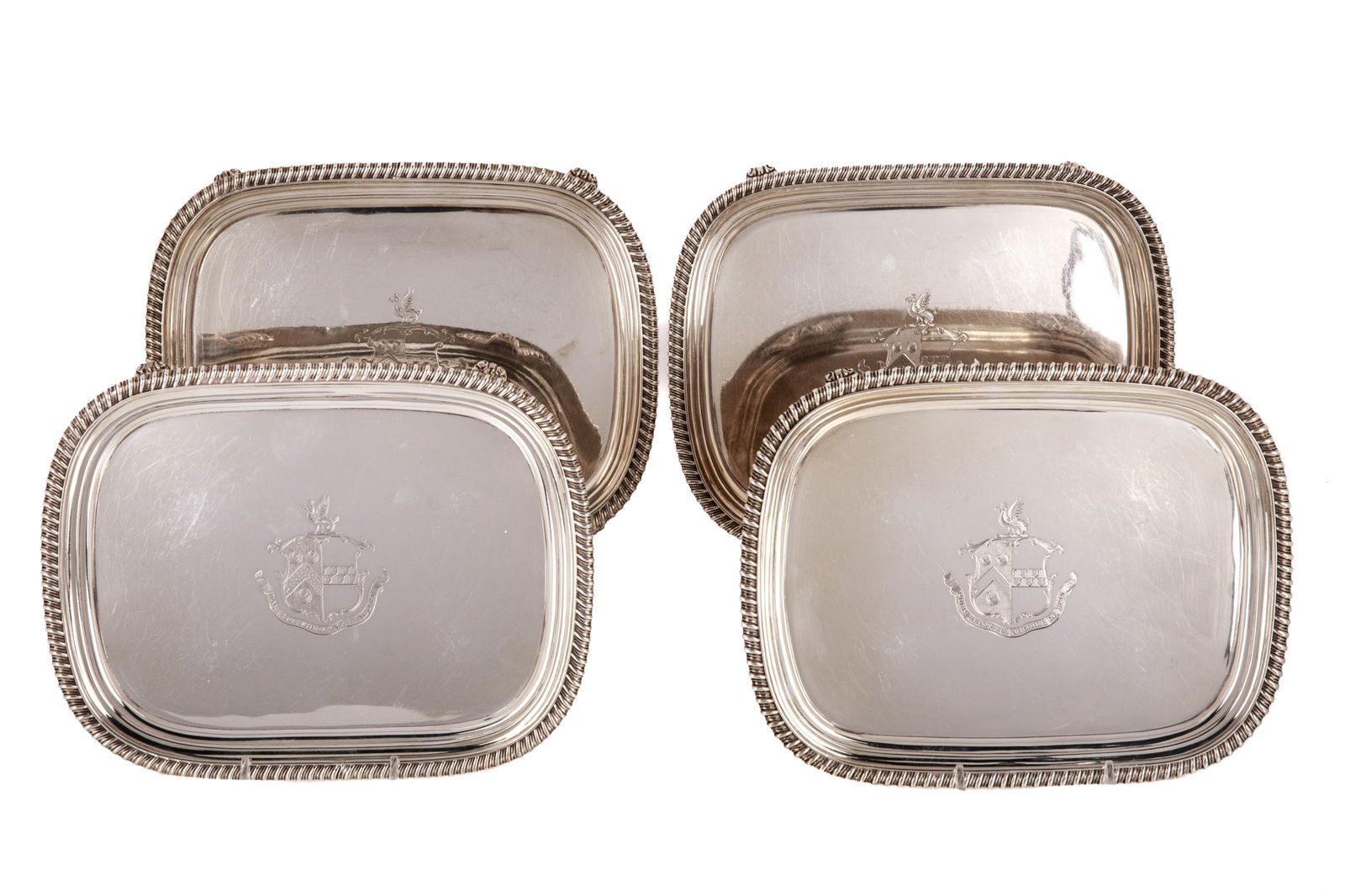 FOUR GEORGE III SILVER SALVERS, 2292g: Four Georgian silver salvers, each with a banded border, four curving feet, and an engraved armorial to the face. All four marked to the underside for London, maker William Bennett; twomarked for 1815
