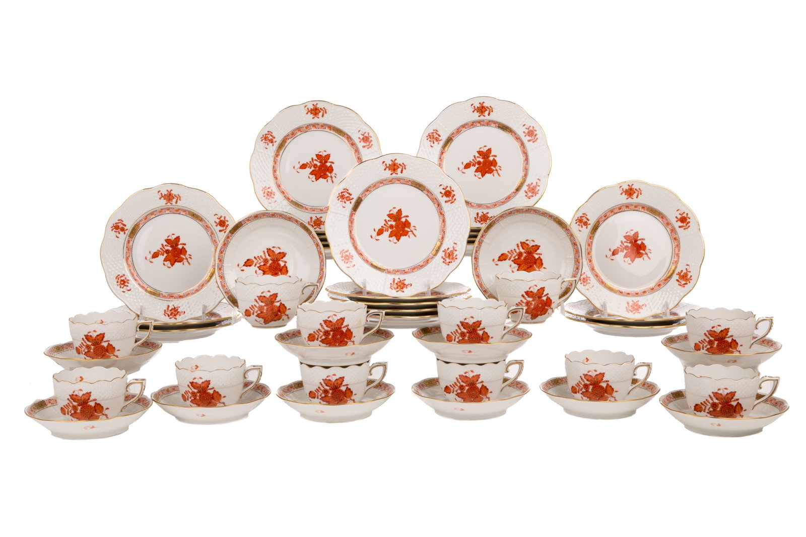 TWELVE HEREND 'CHINESE BOUQUET' TEACUP TRIOS: Group of twelve Herend cup and saucer trios in the rust-coloured 'Chinese Bouquet' pattern. Including twelve demitasse cups, twelve demitasse saucers, and twenty-one bread and butter plates.All marked