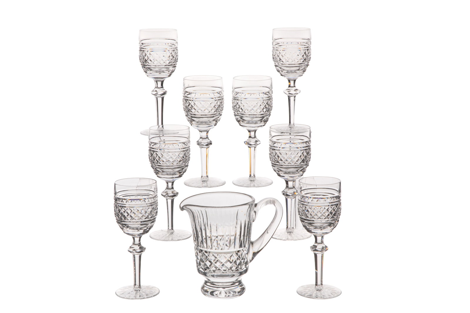 EIGHT WATERFORD 'CASTLETOWN' WINE GLASSES AND JUG: Group of eight Waterford claret wine glasses and a pitcher in the 'Castletown' pattern. All marked for Waterford to the underside. Irish, 20th C.H. of wine glasses: 18 cm (7 1/8 in.)