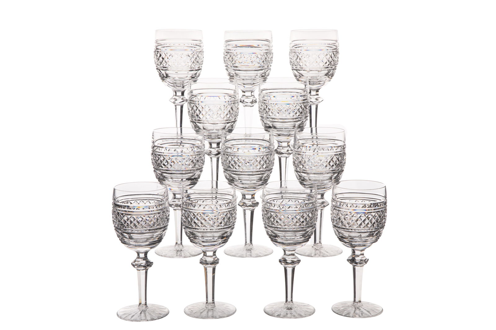 TWELVE WATERFORD 'CASTLETOWN' WATER GOBLETS: Twelve Waterford water goblets in the 'Castletown' pattern with a cut glass knob on the stem. Marked 'Waterford' to the underside. Irish, 20th C.H.: 19.5 cm (7 5/8 in.)