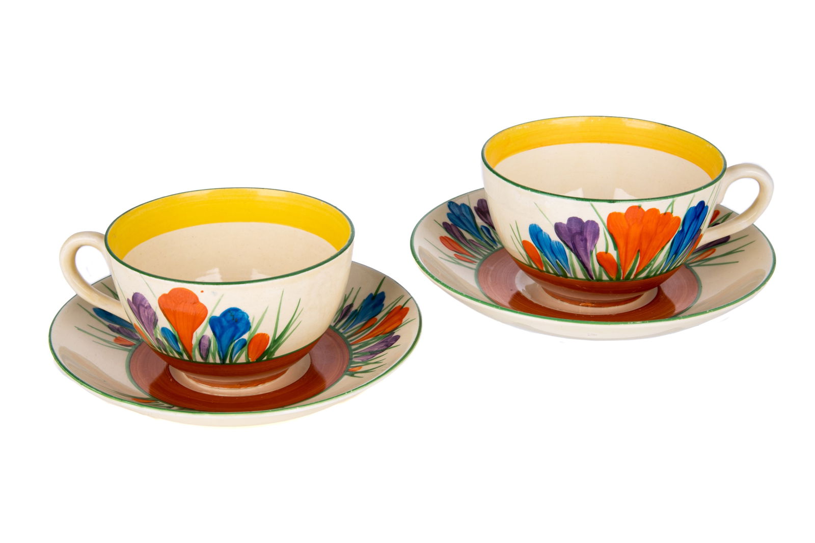 TWO CLARICE CLIFF BIZARRE WARE TEACUPS AND SAUCERS (1 of 2)