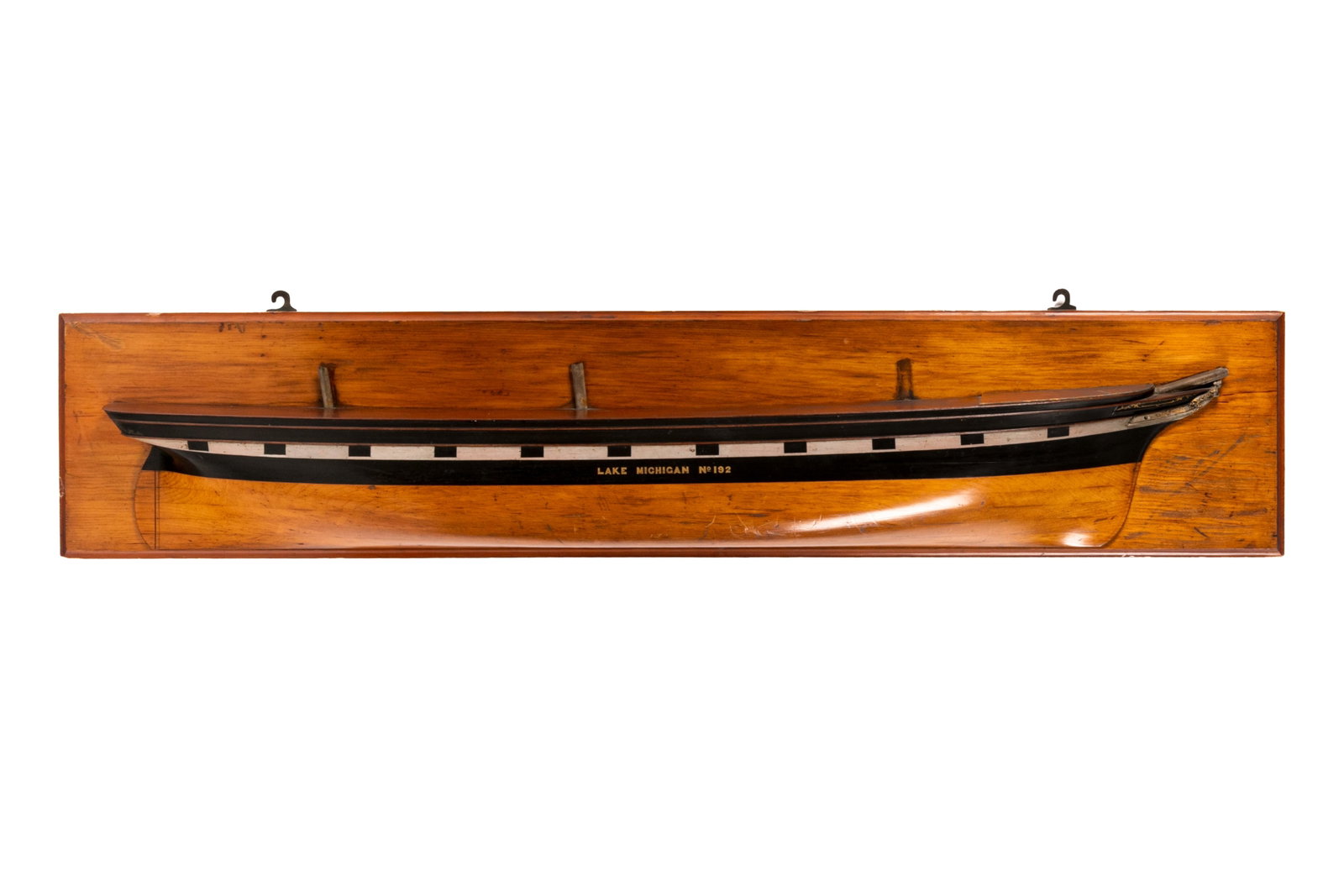 S.S. LAKE MICHIGAN WOODEN HALF HULL MODEL: Smaller, wooden half hull model of S.S. Lake Huron No. 192. Overall measurements: H. 12" x W. 59 1/4" x D. 5". Provenance: William Murray's Canada Shipping Company or Beaver Line S.S. Co. (Montreal); 