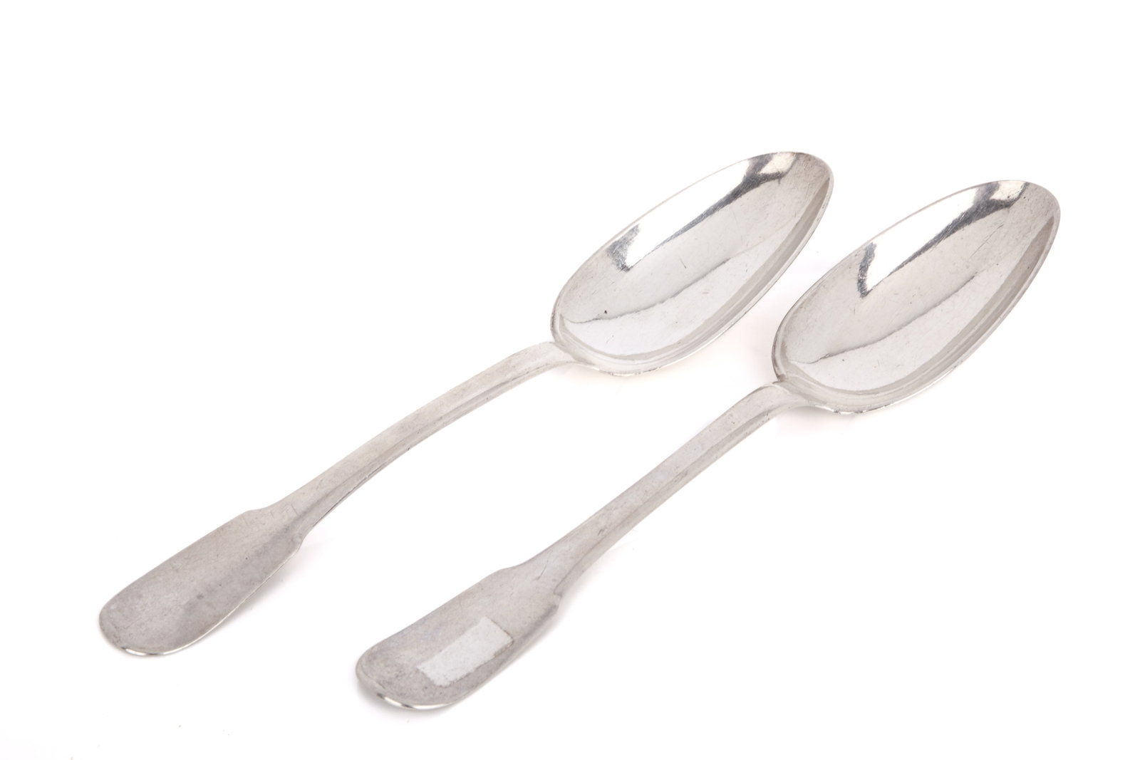 PAIR OF CHARLES FRANCOIS DELIQUE SILVER SPOONS: Fiddle pattern, CM initials on the backs, Montreal Quebec, mid 18th C. Canadian. L 20cm (7 7/8in) 130g