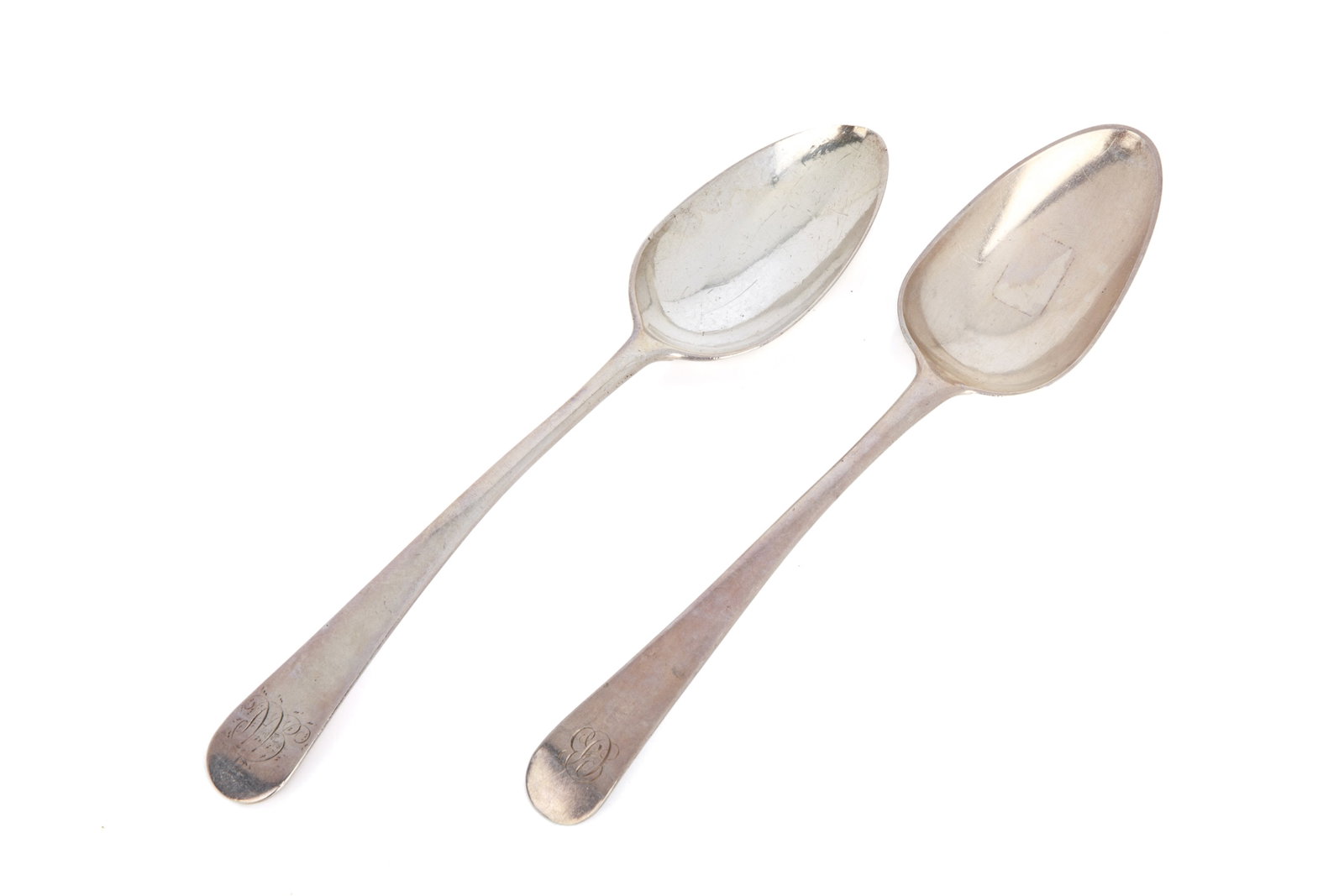 NEAR PAIR OF MICHEL FORTIN CANADIAN SILVER SPOONS: Each with engraved period initials, single and double struck, Quebec City, 18th C. L 21.5cm (8 1/2in) 133g