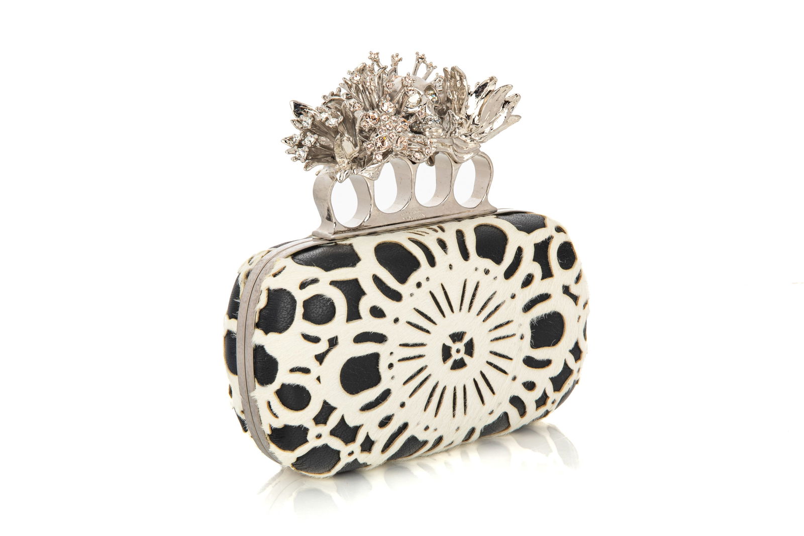 ALEXANDER MCQUEEN LASERCUT CALFHAIR KNUCKLE CLUTCH: Alexander McQueen Lasercut Calfhair and Black Calfskin Leather Embellished Floral Knuckle ClutchSilver-finished handle adorned with four rings and a crystal-encrusted floral cluster, includes dust bag