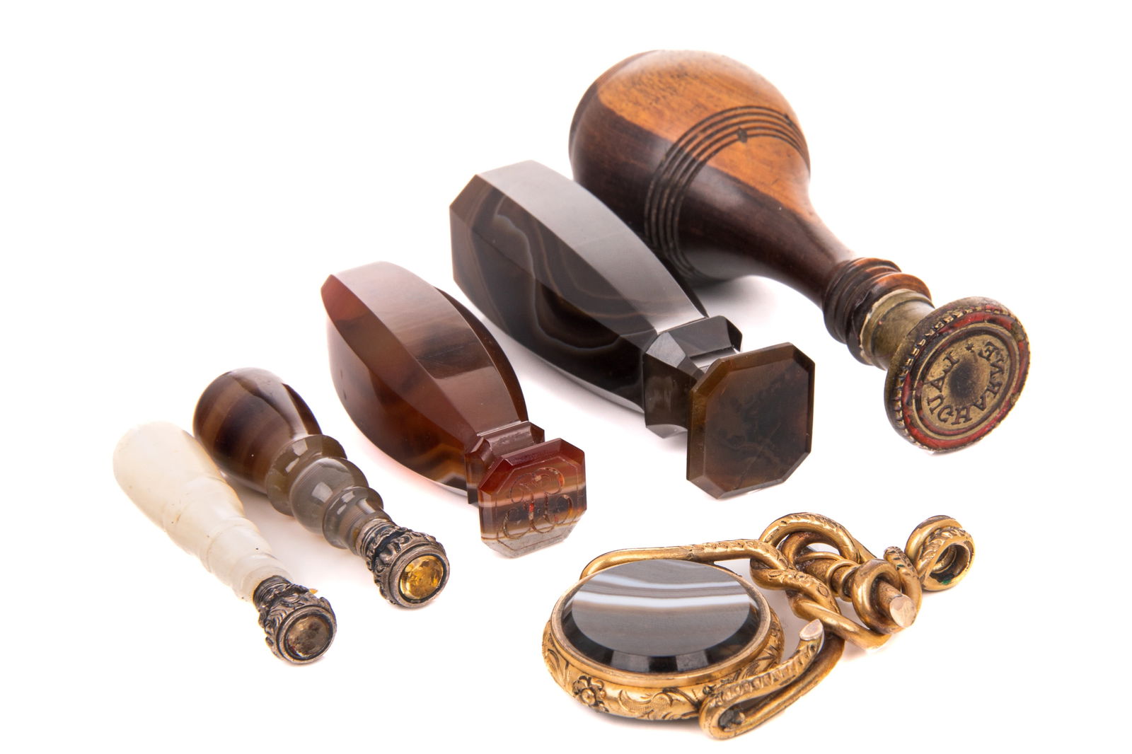 GROUP OF GEORGIAN & VICTORIAN SEALS: Four made of mixed agate, one of abalone and one of carved wood, 18th /19th C. Largest: L. 2 3/4" Smallest: L. 1 3/4"