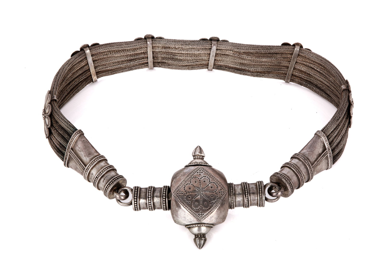 SUBSTANTIAL INDIAN SILVERBRAIDED BELT: Thick mesh belt with applied floral applique, the central buckle with hidden locking mechanism, Indian, 19th C. L 88cm (34 1/2in) Weight 994g weight, silver content