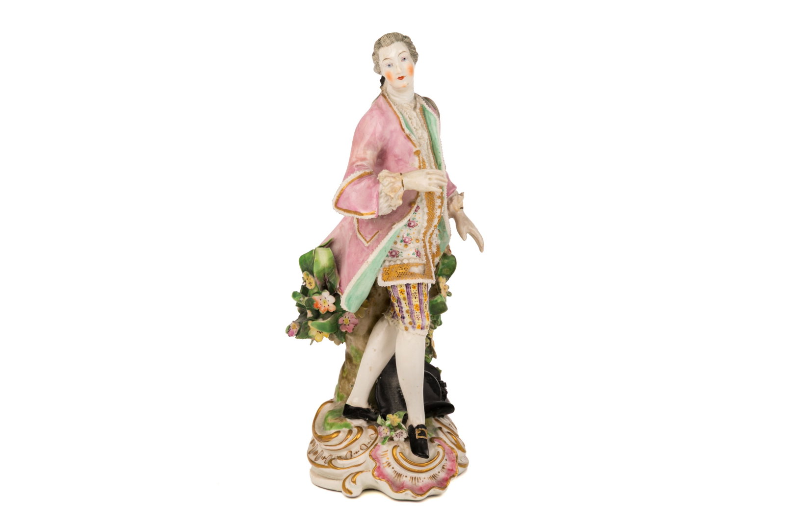 HAND-PAINTED MEISSEN PORCELAIN FIGURE: Hand-painted Meissen porcelain figure of a gentleman in 18th century courtly dress with a pink jacket and floral waistcoat. Marked with the Meissen crossed swords in blue to the underside and incised 