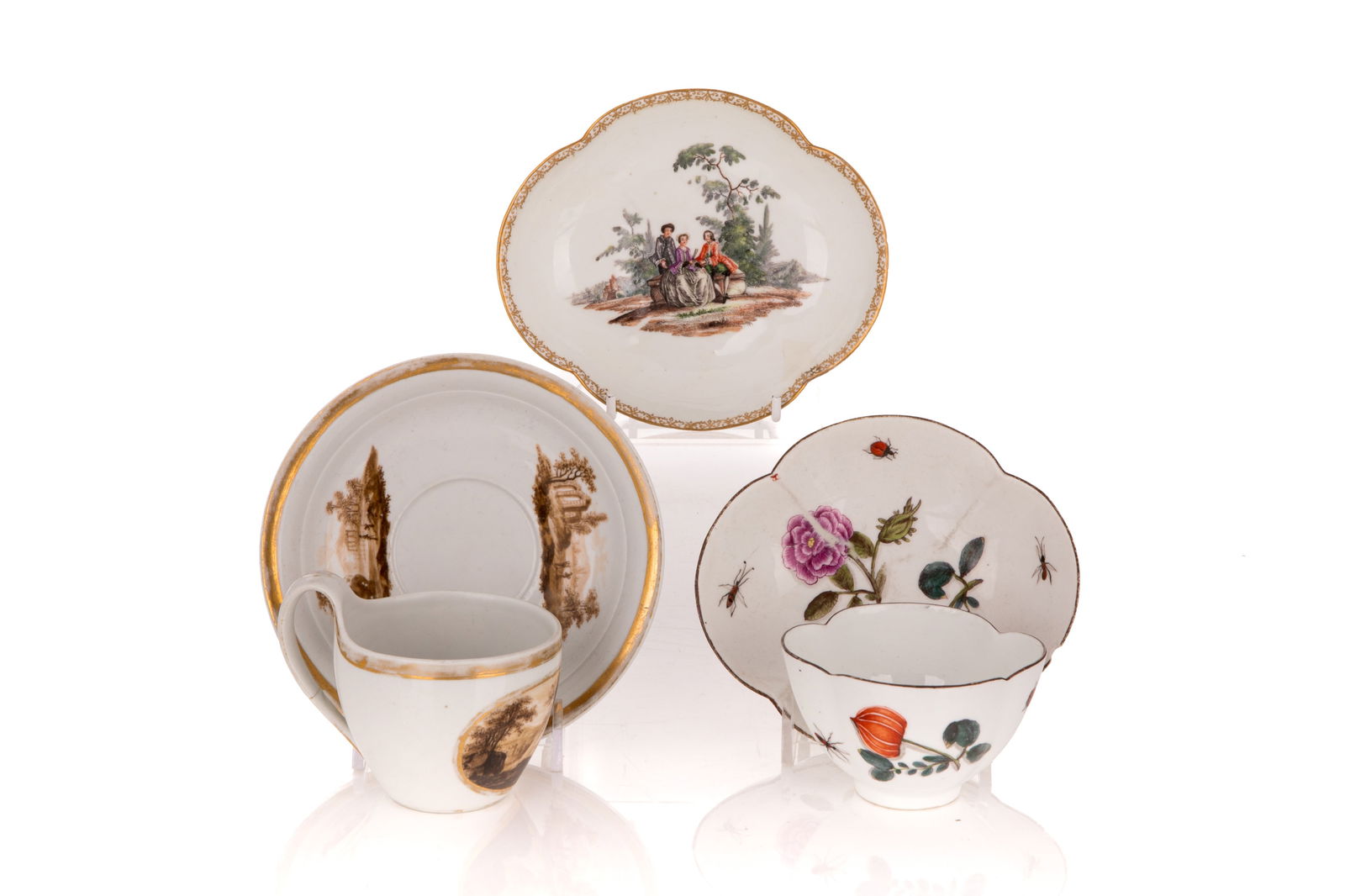 TWO GERMAN PORCELAIN TEA CUPS & SAUCERS: By Meissen and Furstenberg together with a single early Meissen saucer.