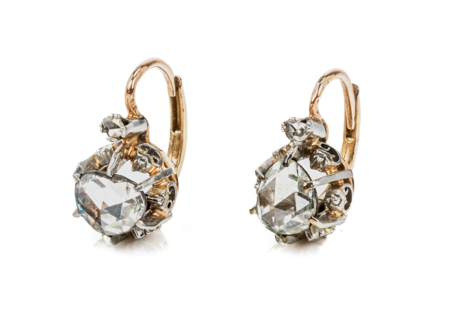 ANTIQUE ROSE CUT DIAMOND DROP EARRINGS 3.9g: 14K yellow gold and platinum antique rose cut diamond dropped earrings Each earring features a foil-backed antique rose cut diamond, 1 roughly pear-shaped, 1 roughlyoval/shield shaped, measuring appro