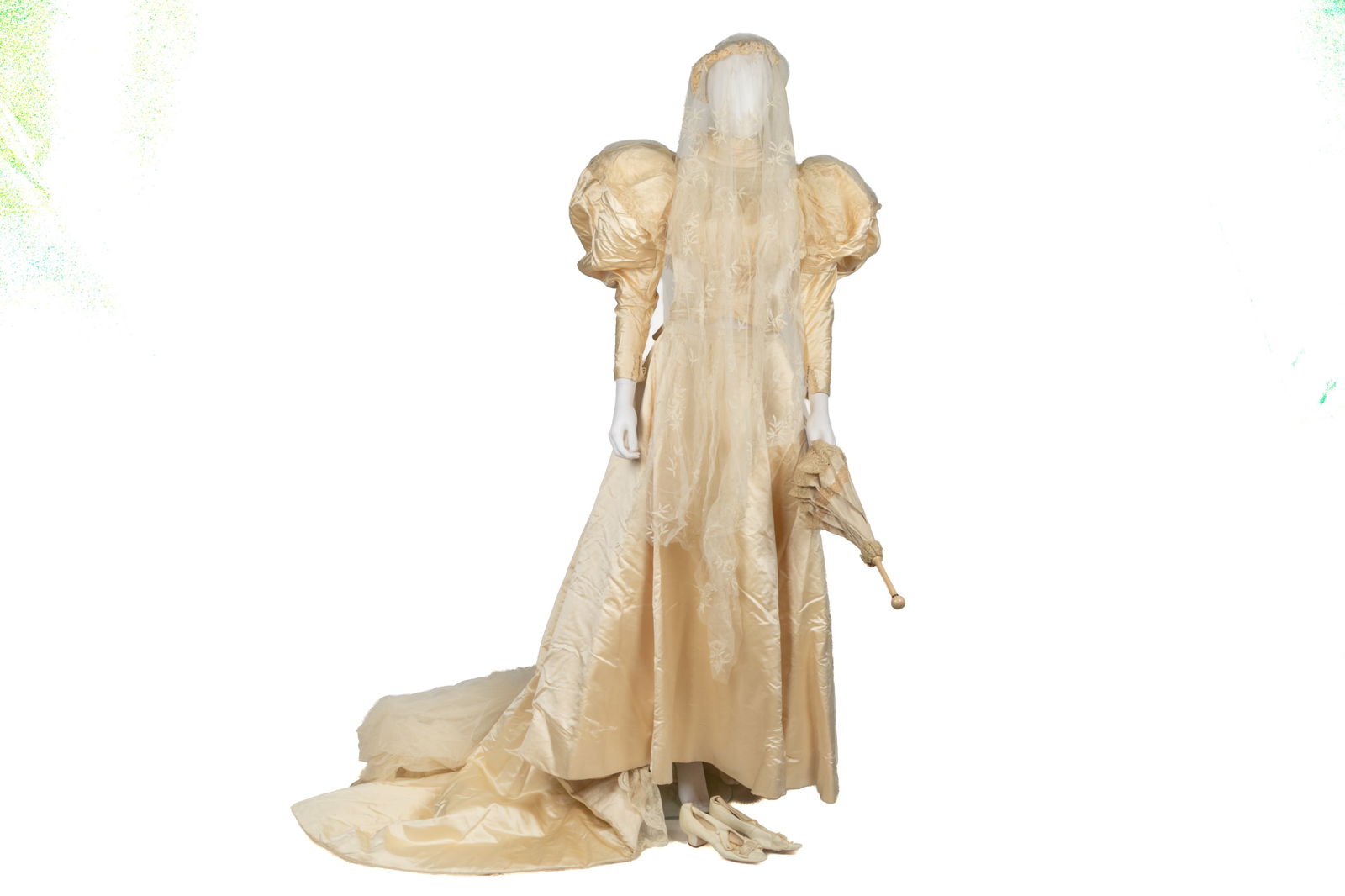 VICTORIAN WEDDING DRESS AND ACCESSORIES: Antique silk gown with puffed sleeves, lace veil, parasol, leather shoes and undergarments.