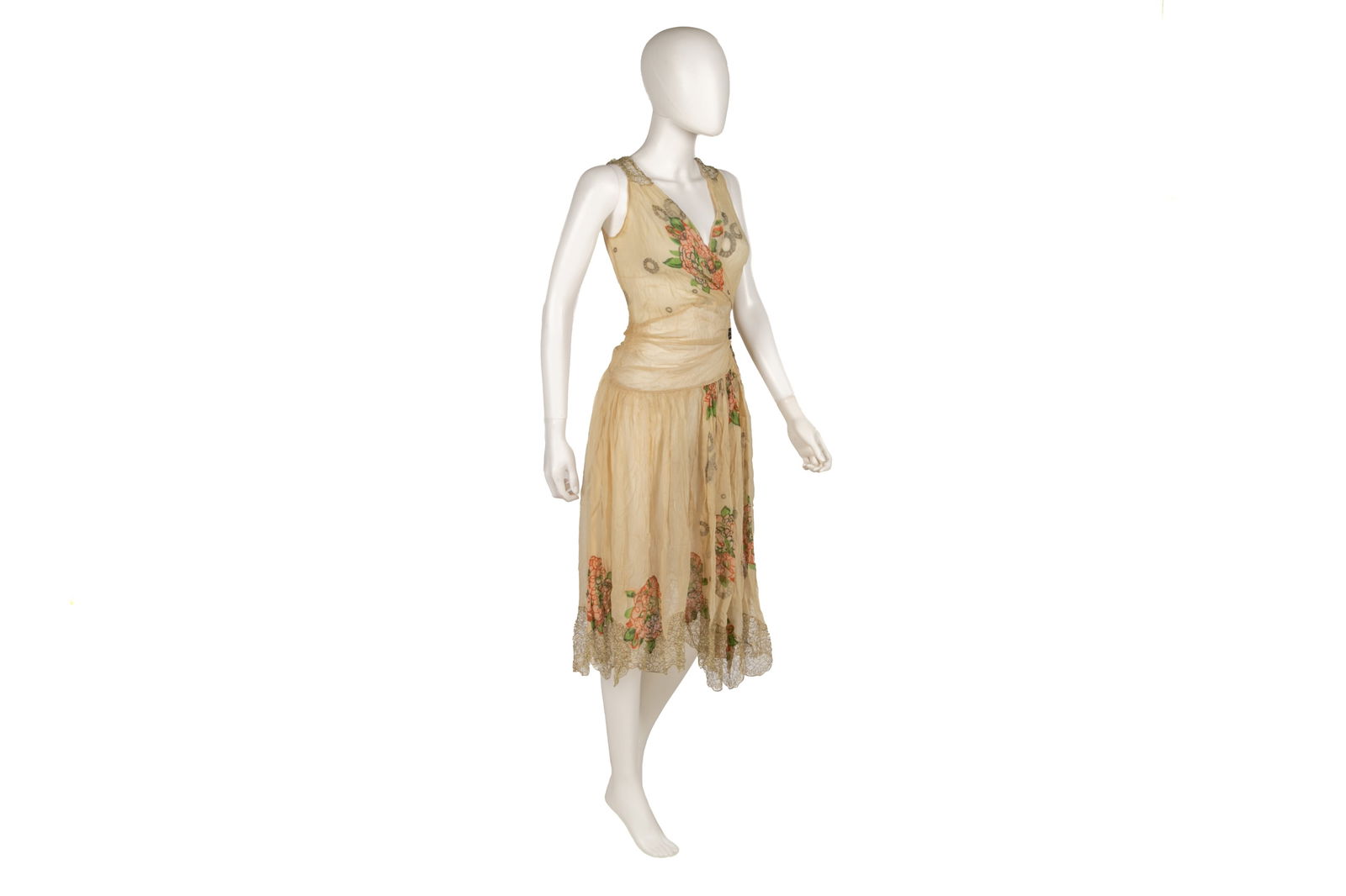 1920S-30S SILK FLORAL DROP-WAIST DRESS: Sheer peach-coloured silk chiffon dress, sleeveless with floral details along the collar and hem, silver thread detailing,