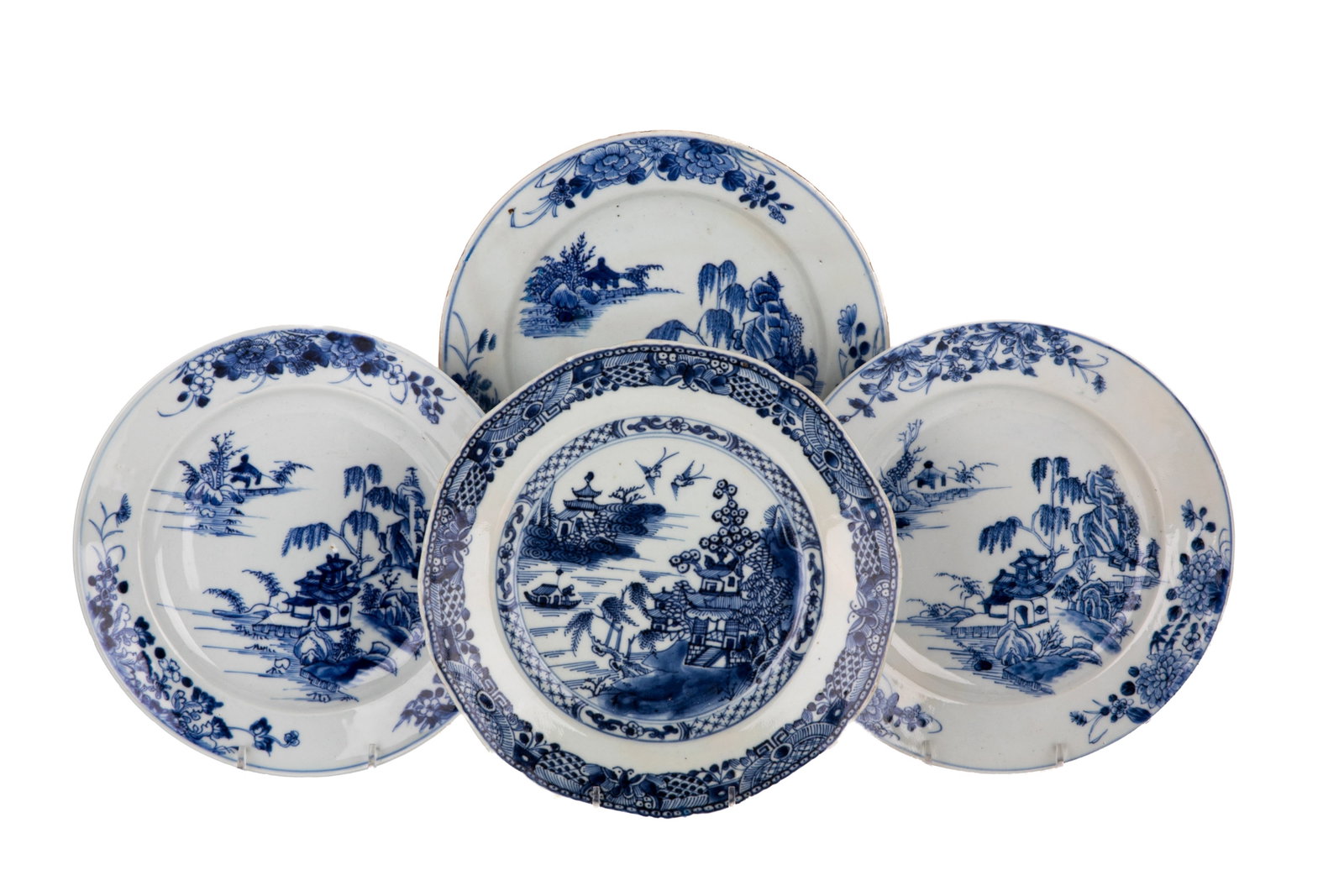 FOUR CHINESE BLUE & WHITE LANDSCAPE DISHES: Decorated with a courtyard amid rockery and willow trees in the cavetto, the rim with chrysanthemum sprays. Underside unmarked.Diam. 23.5 cm each