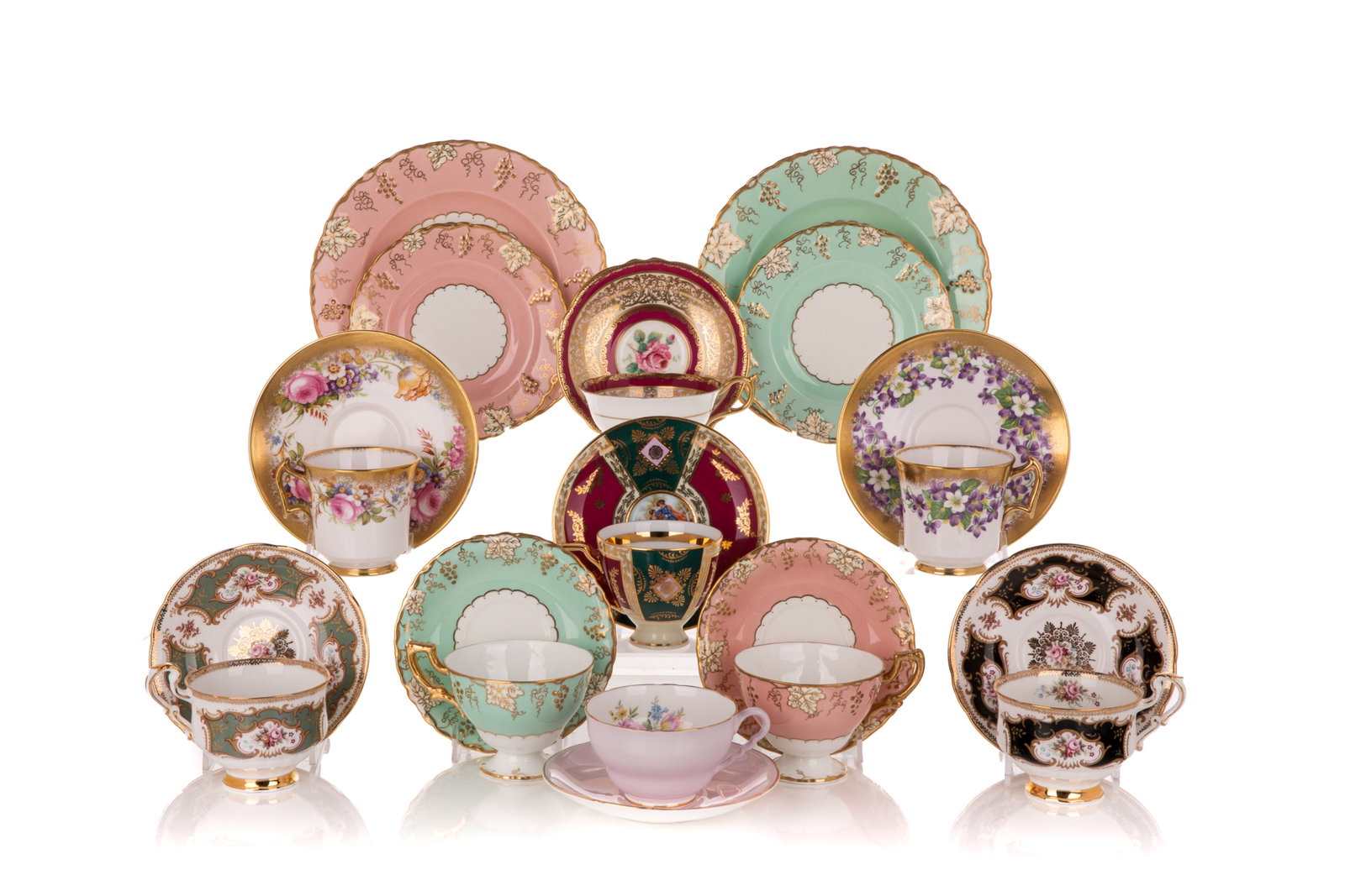 NINE PORCELAIN CUPS AND SAUCERS: Mostly English including Royal Chelsea and Royal Crown Derby. Dia of saucers 5 1/2" (14 cm)