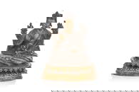 SILVER AND GILT BRONZE FIGURE OF A SEATED LAMA