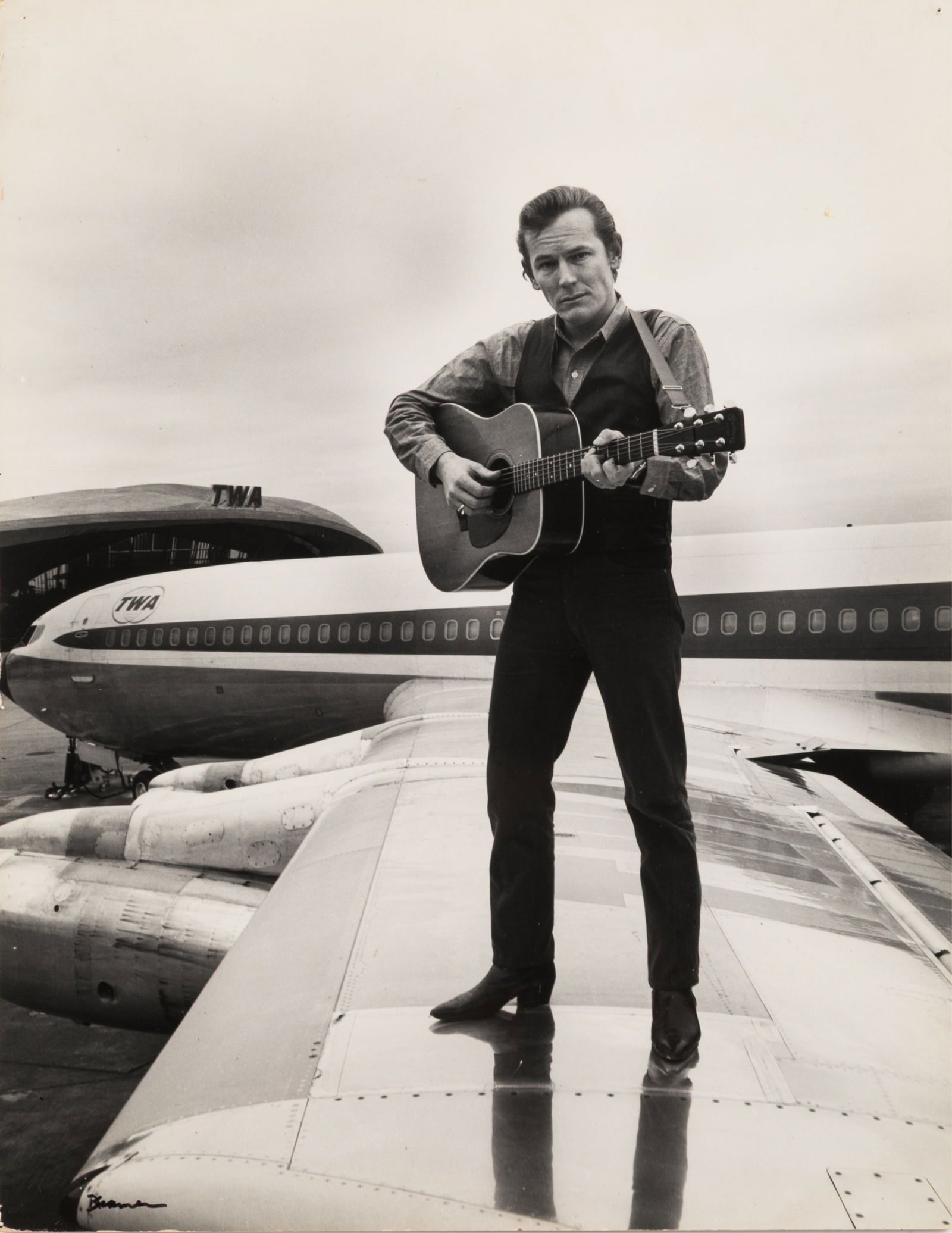 EARLY PHOTO OF LIGHTFOOT ON AIRPLANE WING (1 of 2)