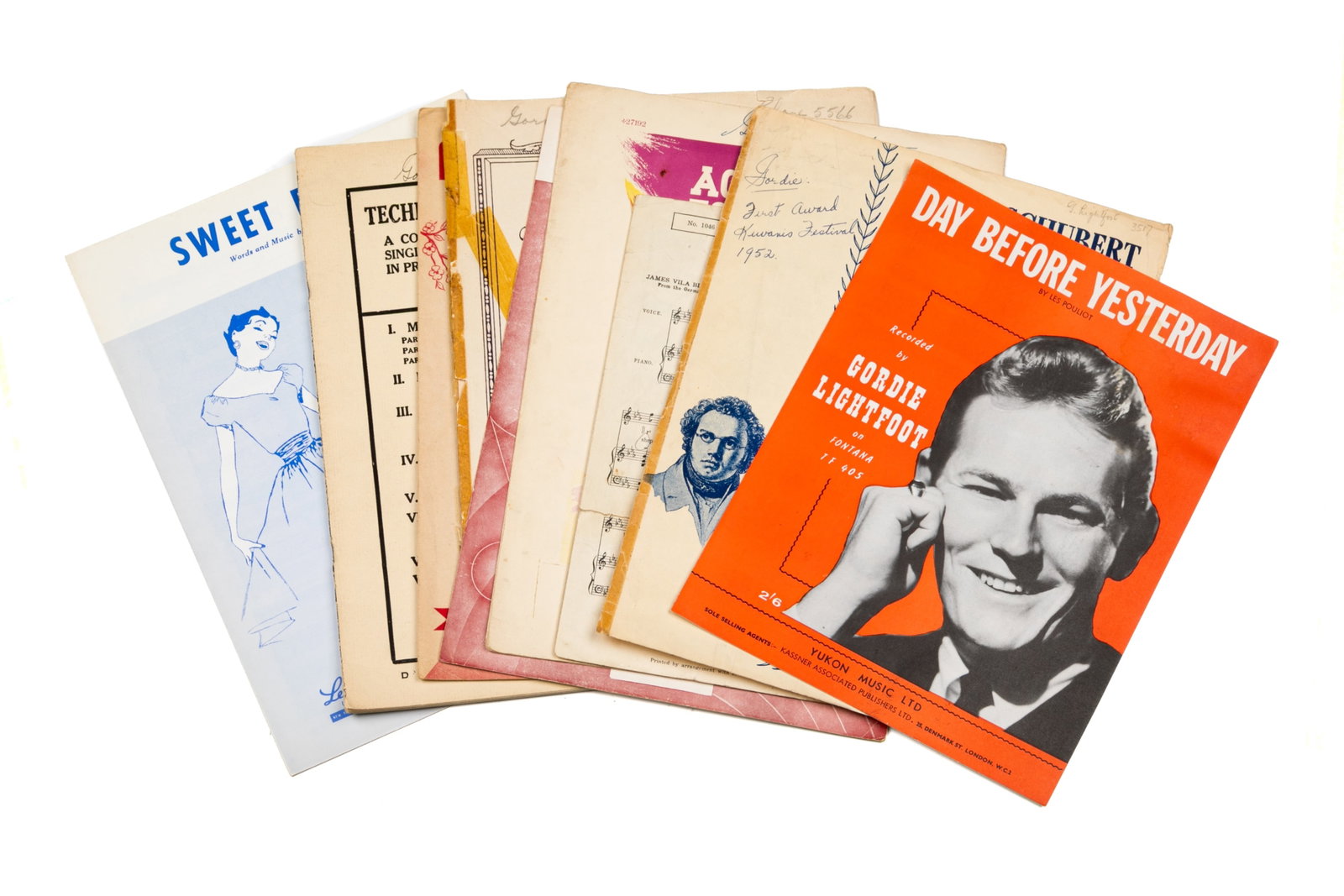 ASSORTED EARLY MUSIC BOOKS OWNED BY LIGHTFOOT: Music books from Lightfoot's early childhood with songs and music sheets, each with personalized doodles, notes and signatures.