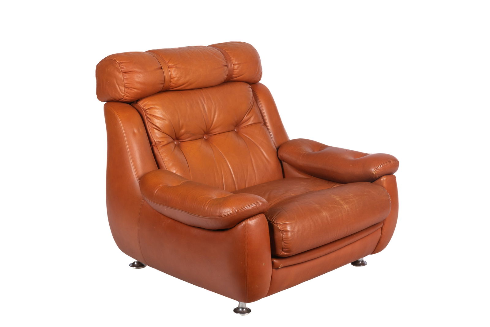 VINTAGE CARMEL LEATHER CHAIR: Circa 1970, from Gordon Lightfoot's personal home. Chair H 33 x W 36 x D 33in