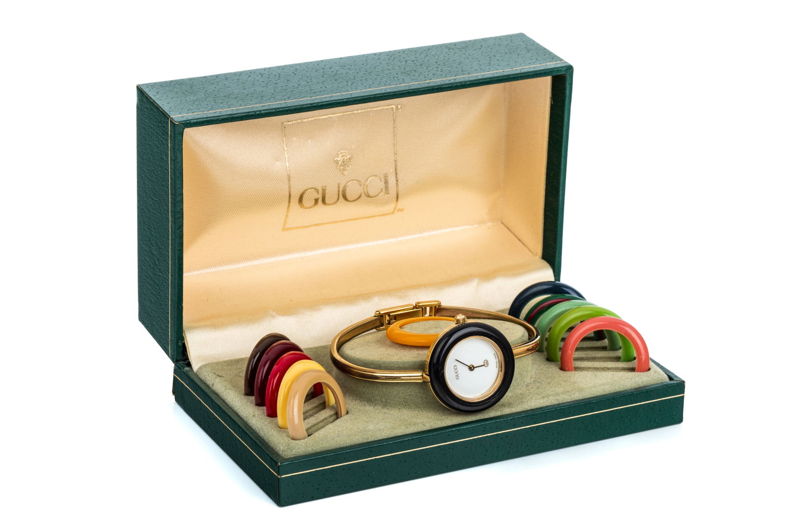 VINTAGE GUCCI 1100L CHANGE BEZEL w 12 COLOURS: Vintage Gucci Quartz 1100L 11/12 Change Bezel watch with 12 bezels and original box. 25.8mm round case. New cell needed.