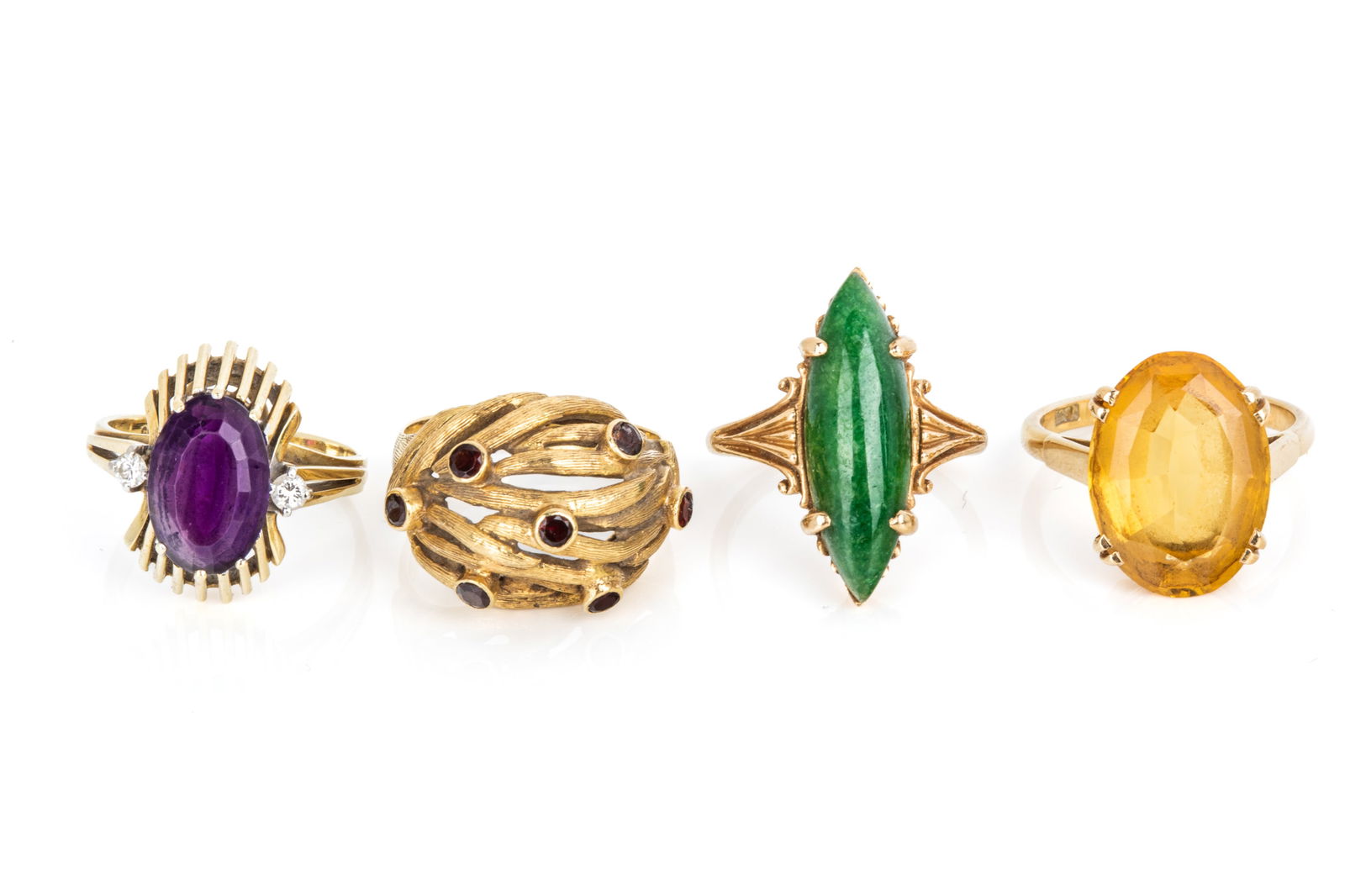 FOUR GOLD & GEMSTONE RINGS 21.8g: 18K yellow gold and red garnet ring (2 garnets are broken). 8 grams 18K yellow gold oval faceted 16.6 x 12mm citrine ring. Size 7 5.4 grams 14K yellow gold amethyst and diamond ring. Size 6 4.5 grams