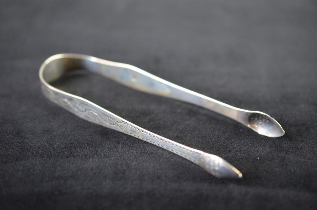 GEORGIAN SILVER SUGAR NIPS: Bright cut decoration, Peter & Jonathan Bateman, London, circa 1790. L 14 cm. (5 1/2 in.) W 25g