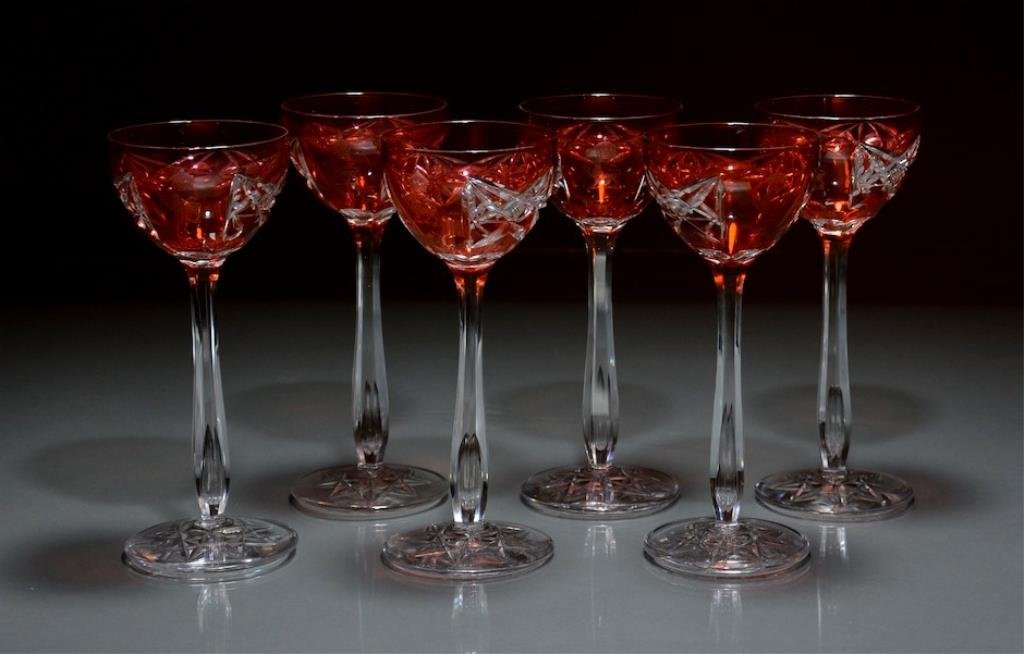 SEVEN FLASHED HOCK GLASSES WITH CREST: Probably Val St. Lambert cranberry flashed glass with crest of the Governor General of Canada beneath a crown. H 20 cm. (7 7/8 in.)
