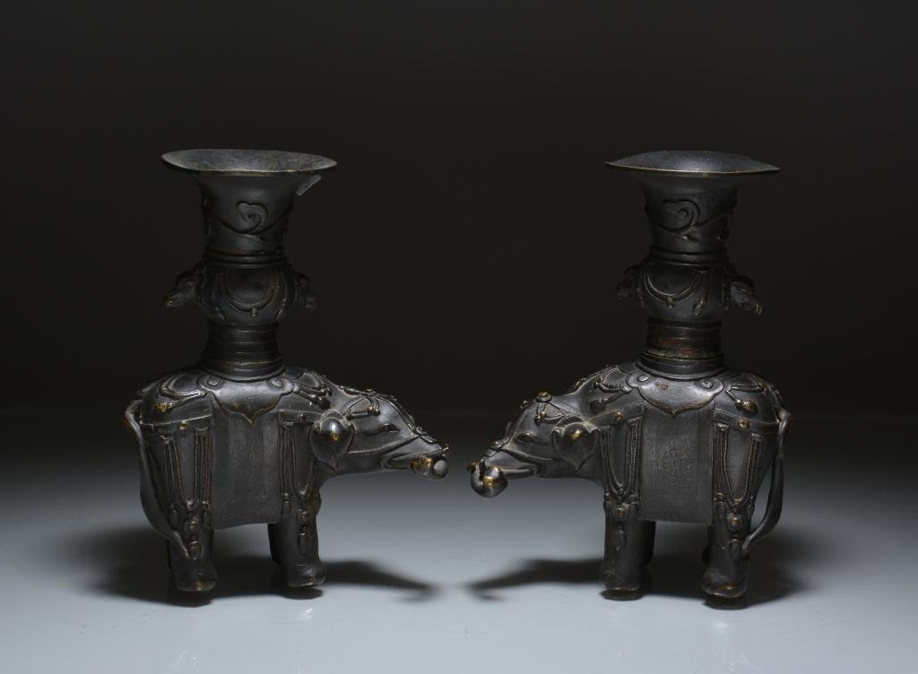 PAIR OF CHINESE BRONZE ELEPHANT INCENSE STANDS: Jeweled elephants carrying double-handled gu vases with jewel and floral decorations, 17th-18th century. H. 19cm (7.5 in.) Provenance: A third generation estate from St. Catherines.