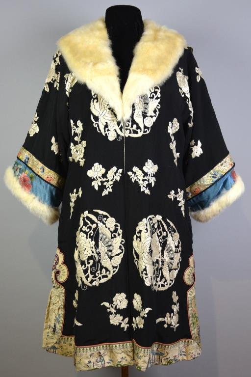 FINE EMBROIDERED SILK AND FUR LADY'S WINTER COAT: Black ground coat with creamy-white embroidered butterflies, with ornately embroidered bands. White ermine collar and cuff. Early Republican period. L. 106cm (41 3/4 in.)