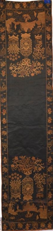 CHINESE EXPORT SILK ALTAR PANEL: Black silk ground with light brown and red embroidered vases above a river scene, bordered by interchanging figures of water buffalo, willow, and boys. 127 x 29.5cm (50 x 11 5/8 in)