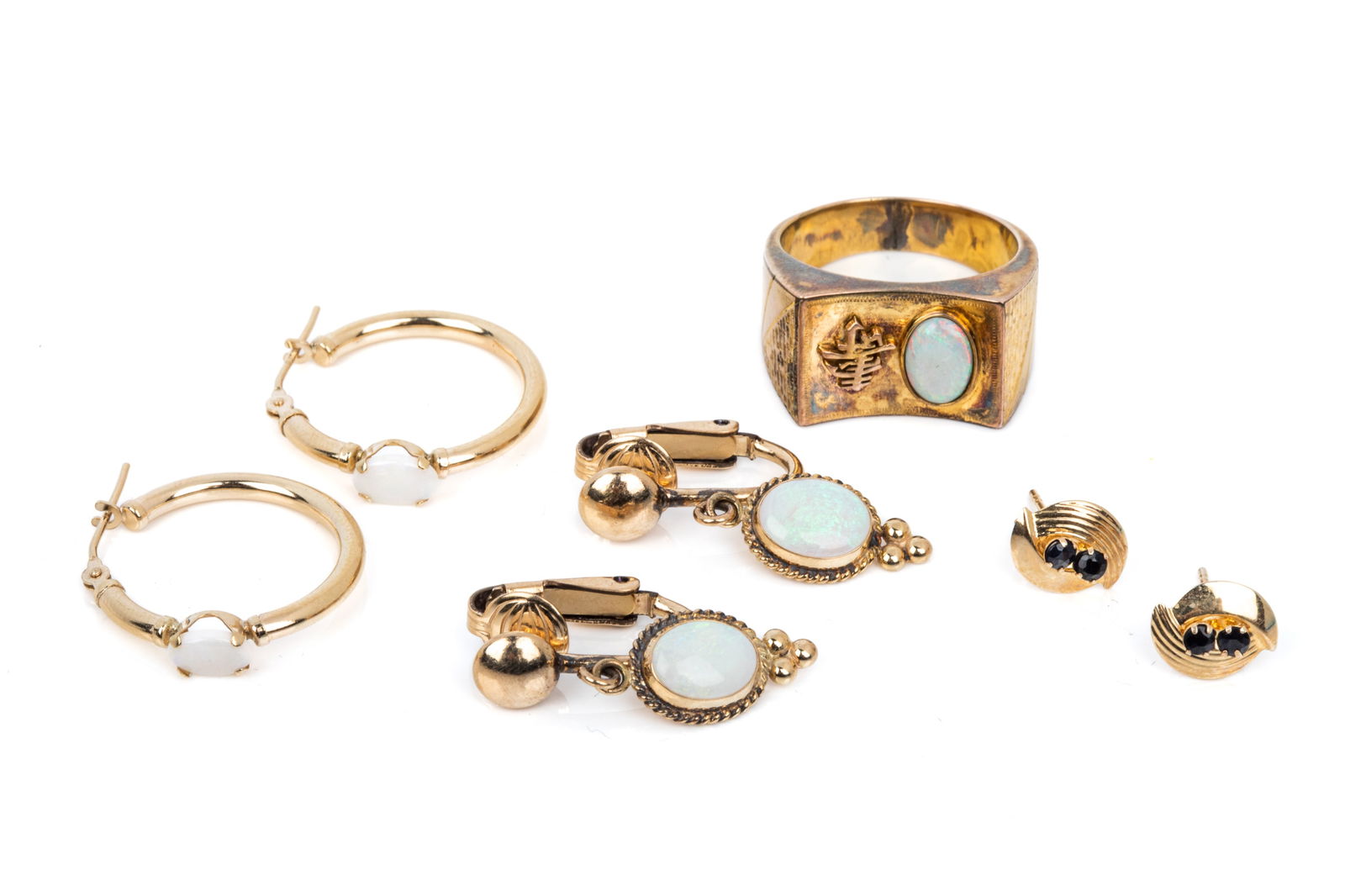 14K GOLD & GEMSTONE JEWELLERY GROUPING 10g: 14K yellow gold ring measuring 10.9mm wide, featuring the shou Chinese character for longevity and an oval cabochon cut white opal. Size 6.755.5 grams 14K yellow gold hollow constructed hoop earrings