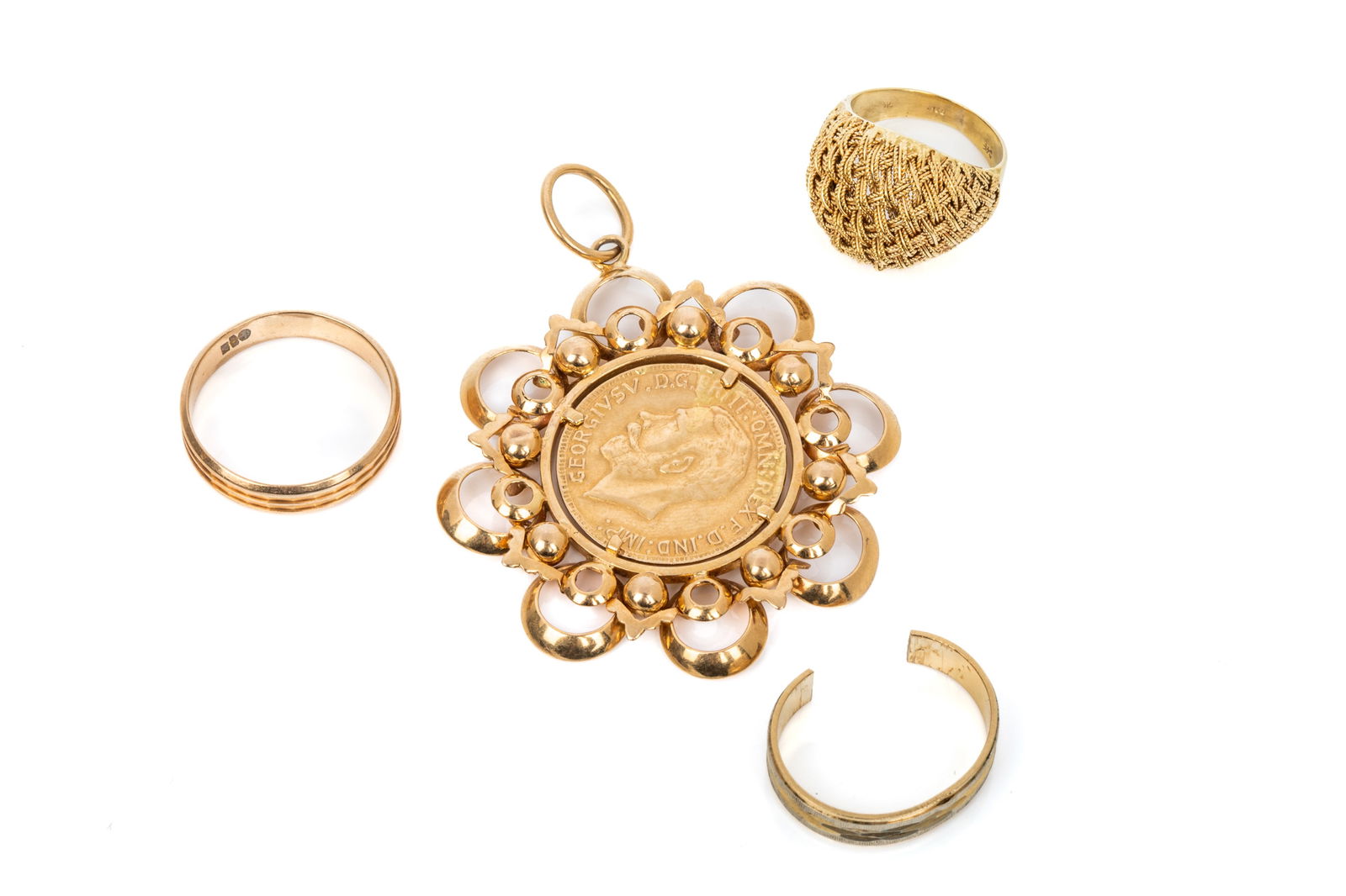 18K YELLOW GOLD MIXED JEWELLERY 23.6g: 2 18K yellow gold pattern bands, 1 cut open. 6.6 grams 18K yellow gold coin frame pendant with faux sovereign imitation coin.11.5 grams 18K yellow gold woven top dome ring (dented). 5.4 grams