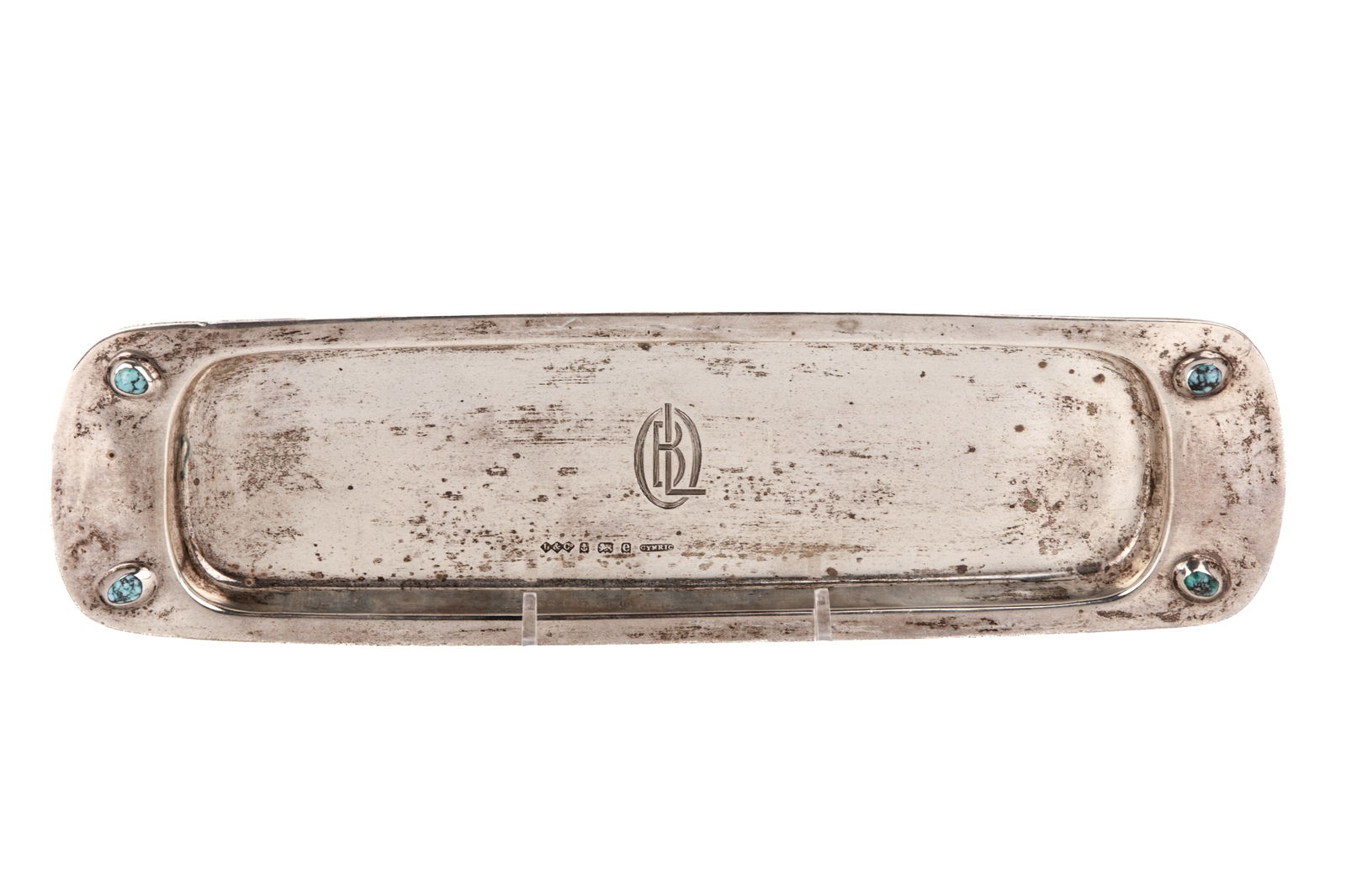 LIBERTY ARTS & CRAFTS SILVER TRAY, 181g: Attributed to Archibald Knox with four turquoise mounted cabochons, engraved monogram. Birmingham, 1906, Liberty & Co. L 28cm (11in)