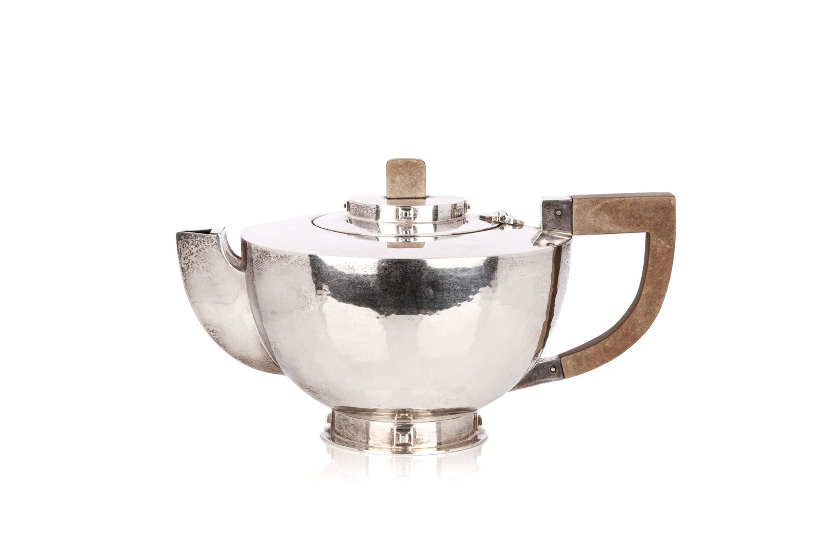CHARLES BOYTON STUDIO SILVER TEAPOT, 671g: A fine Art Deco sterling silver teapot from the studio of Charles Boyton, London hallmarks for 1933. The piece also bears his signature on the foot. Very Clean lines with geometric accents. Weight