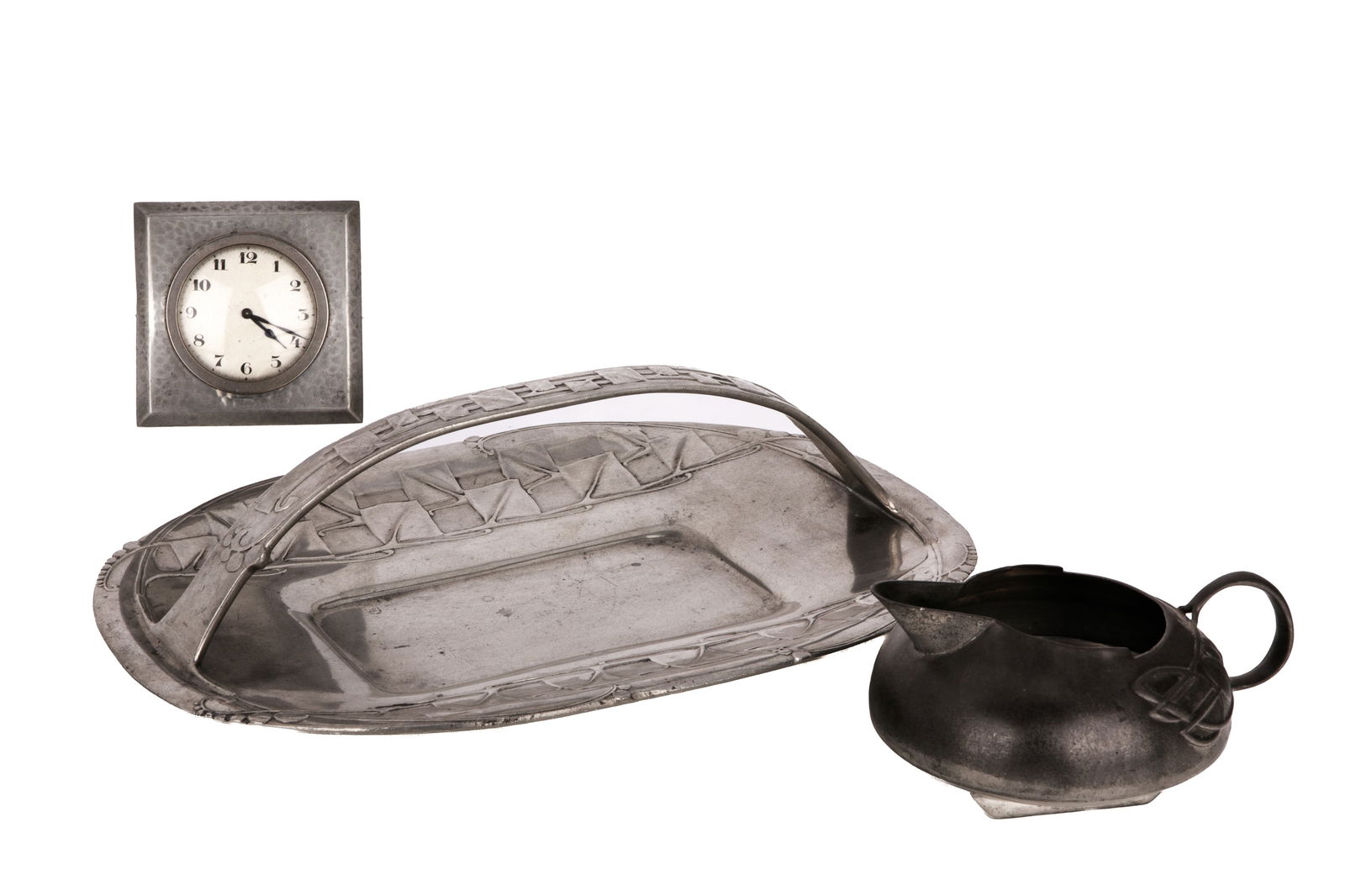 THREE PIECES OF ARTS & CRAFTS ENGLISH PEWTER: Liberty & Co Tudric desk clock, Tudric cream jug model 0231 and Tudric basket model 0357. L of basket 30.5cm (12in)