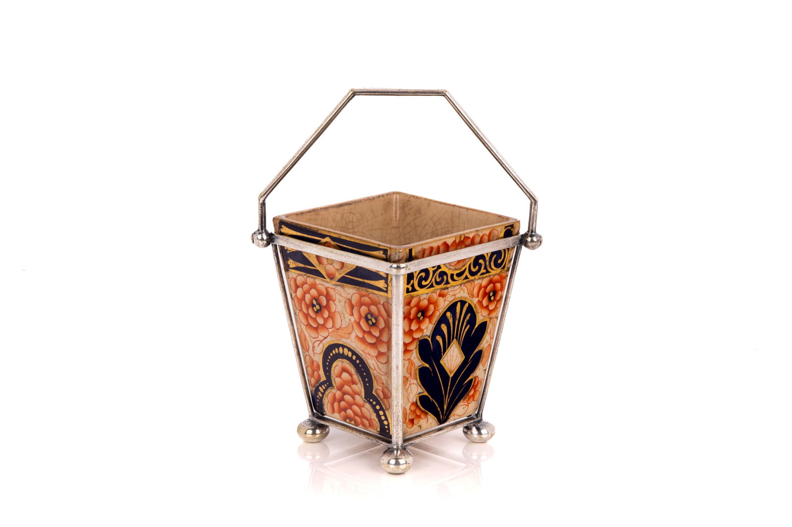 CHRISTOPHER DRESSER BASKET: A 19th century English pottery basket in Imari colours in a silver plated frame. Examples like this have been associated with the well known English designer Christopher Dresser. Frame marked