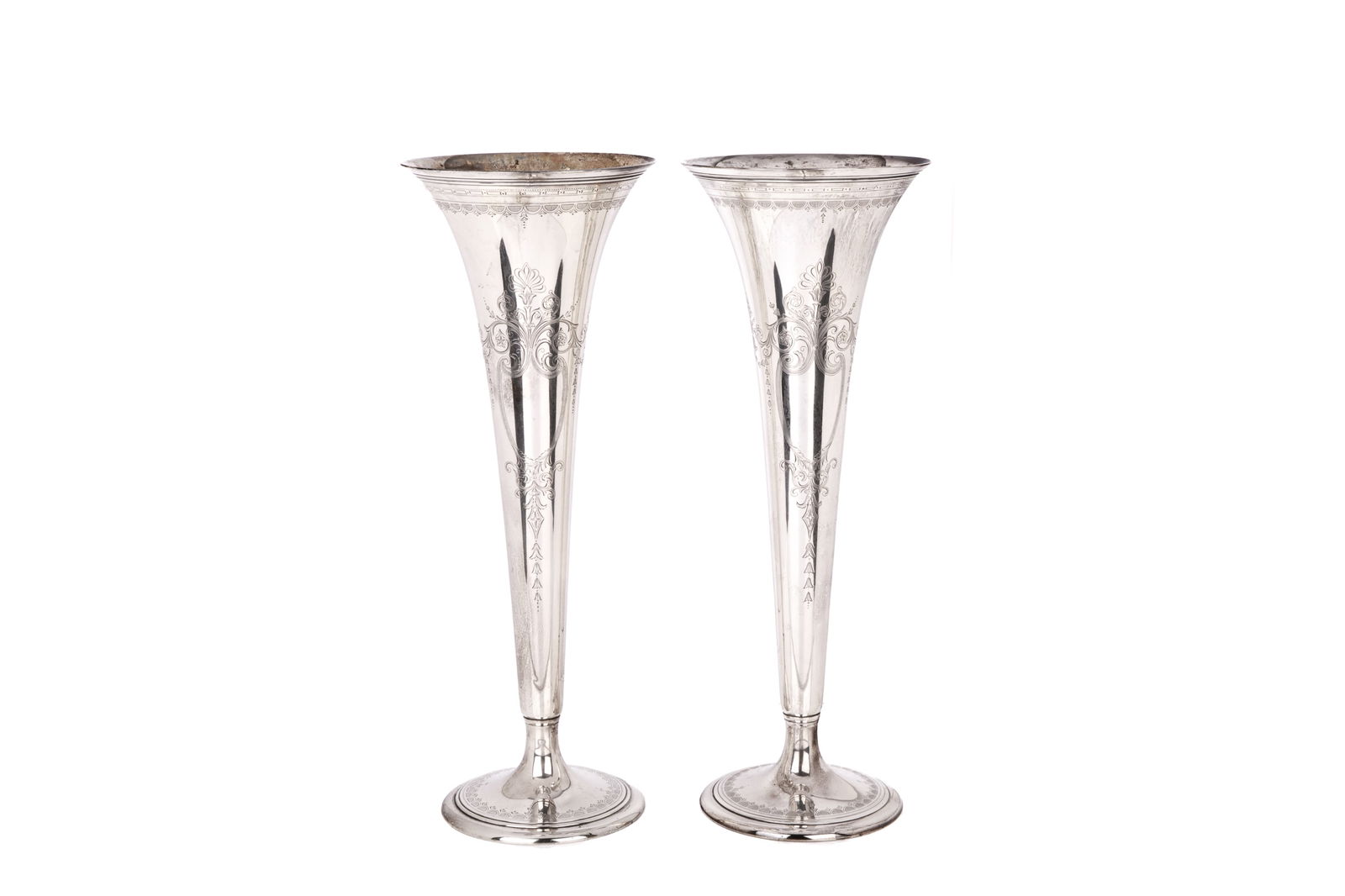 PAIR OF LARGE TIFFANY SILVER TRUMPET VASES, 2,250g: Characterized by a narrow body that flares out at the top. Rounded foot. Featuring etched floral and foliate motifs.H. 20 1/8" x Dia. 7 1/2"