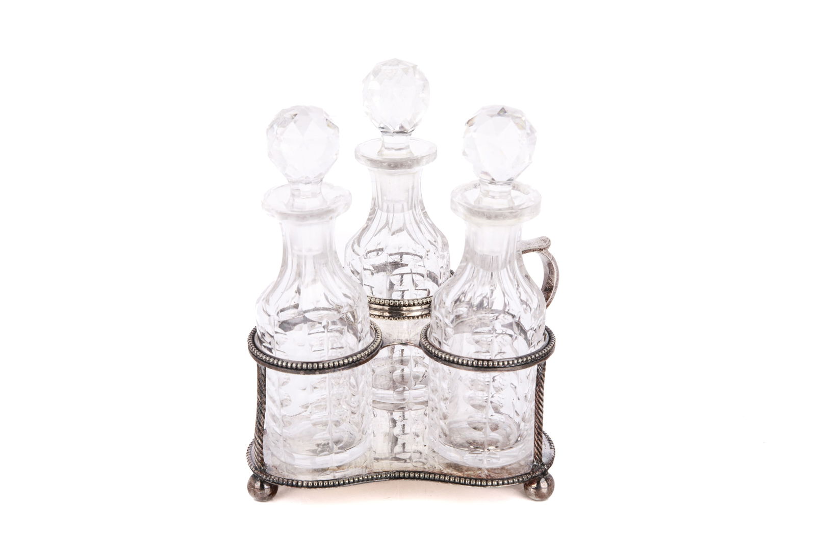 SMALL ENGLISH VICTORIAN SILVER CRUET (112g): A mid 19th century diminutive silver three bottle cruet. The stand bears the makers mark only, SW, possibly for Samuel Whitford and has not been assayed. Weight of stand 112 G. Glass H. 4