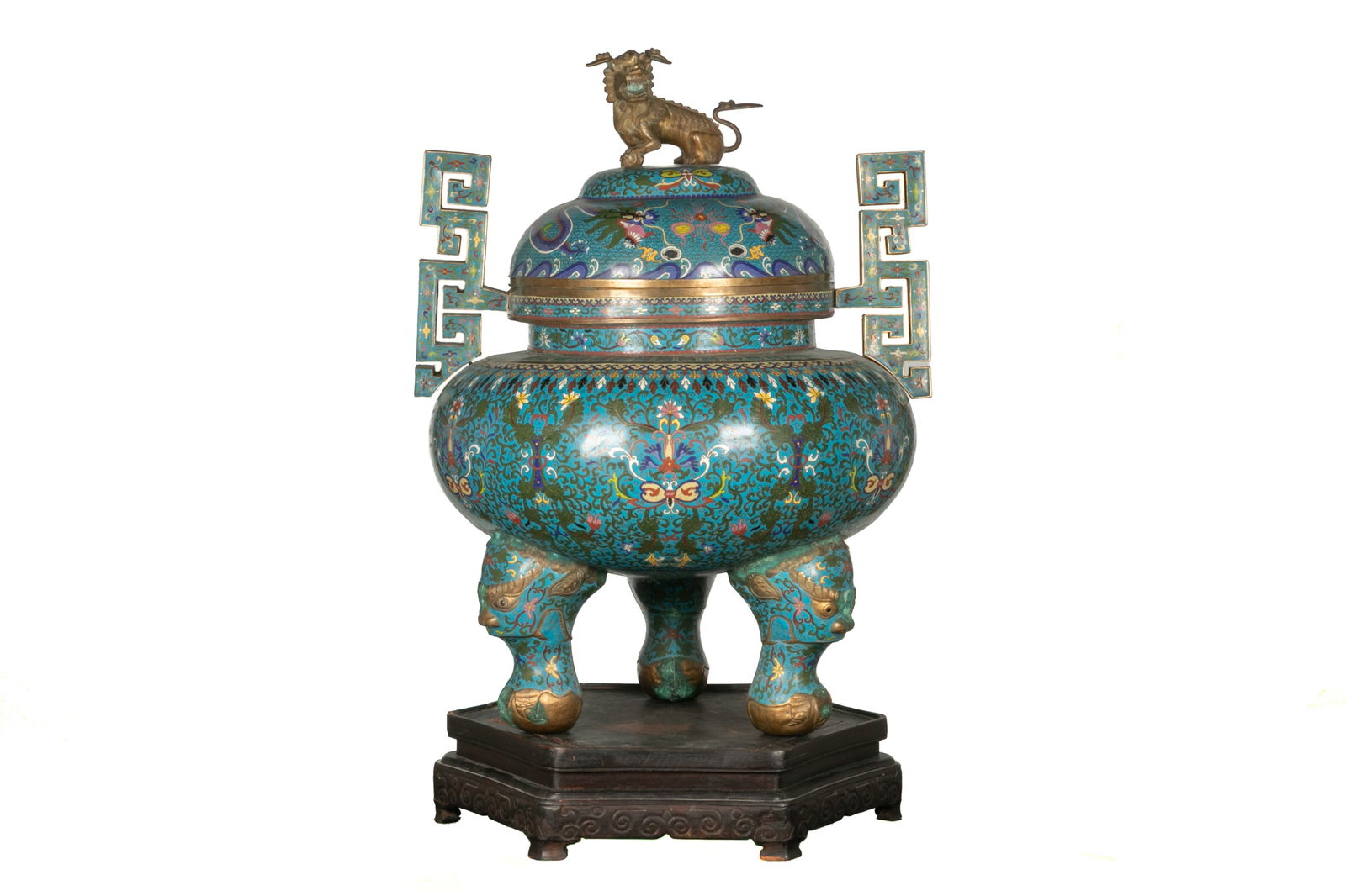MONUMENTAL CLOISONNE ENAMELLED COVERED CENSER: Traditional Chinese form in blue cloisonne with fu dog finial and archaistic handles, 20th C. Life size. H. with stand 47",Dia. of the stand 26"