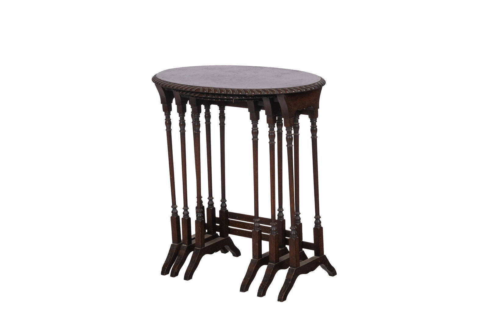 GEORGE III STYLE NEST OF THREE TABLES: Oval table with gadrooned edge, English, early 20th C. Height of largest 24" x W 22"