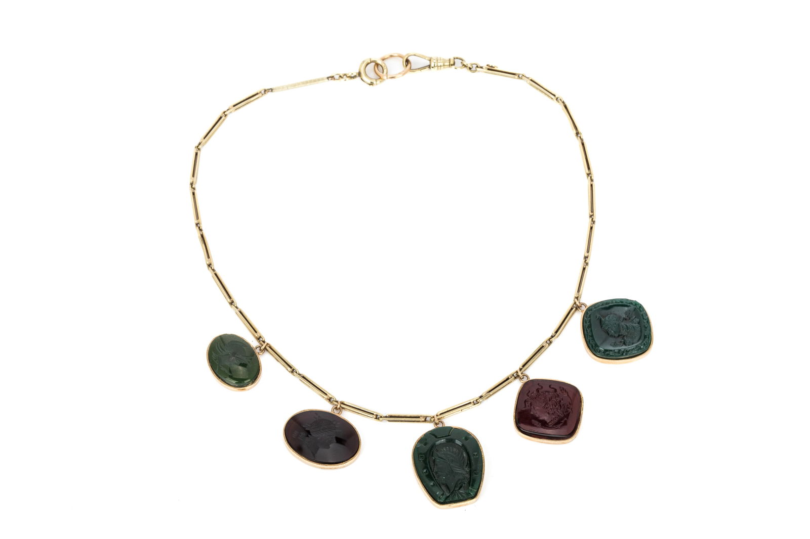 14K INTAGLIO NECKLACE 34g: 14K yellow gold antique pocket watch chain converted into a necklace, measuring 15.5 inches long Featuring a varied collection of glass intagliopendants 34 grams