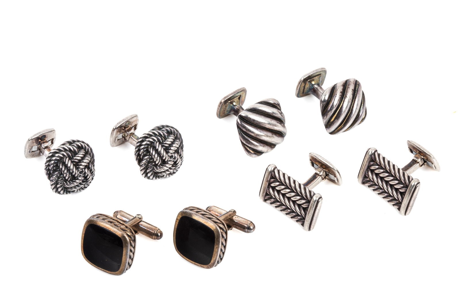 4 PAIRS OF DAVID YURMAN STERLING CUFFLINKS 87.8g: David Yurman Chevron Cufflinks in Sterling Silver, measuring 22.9mm long by 13.7mm wide. 20 grams David Yurman Maritime Rope Cufflinks in SterlingSilver, measuring 17.8mm wide. 25.8 grams David
