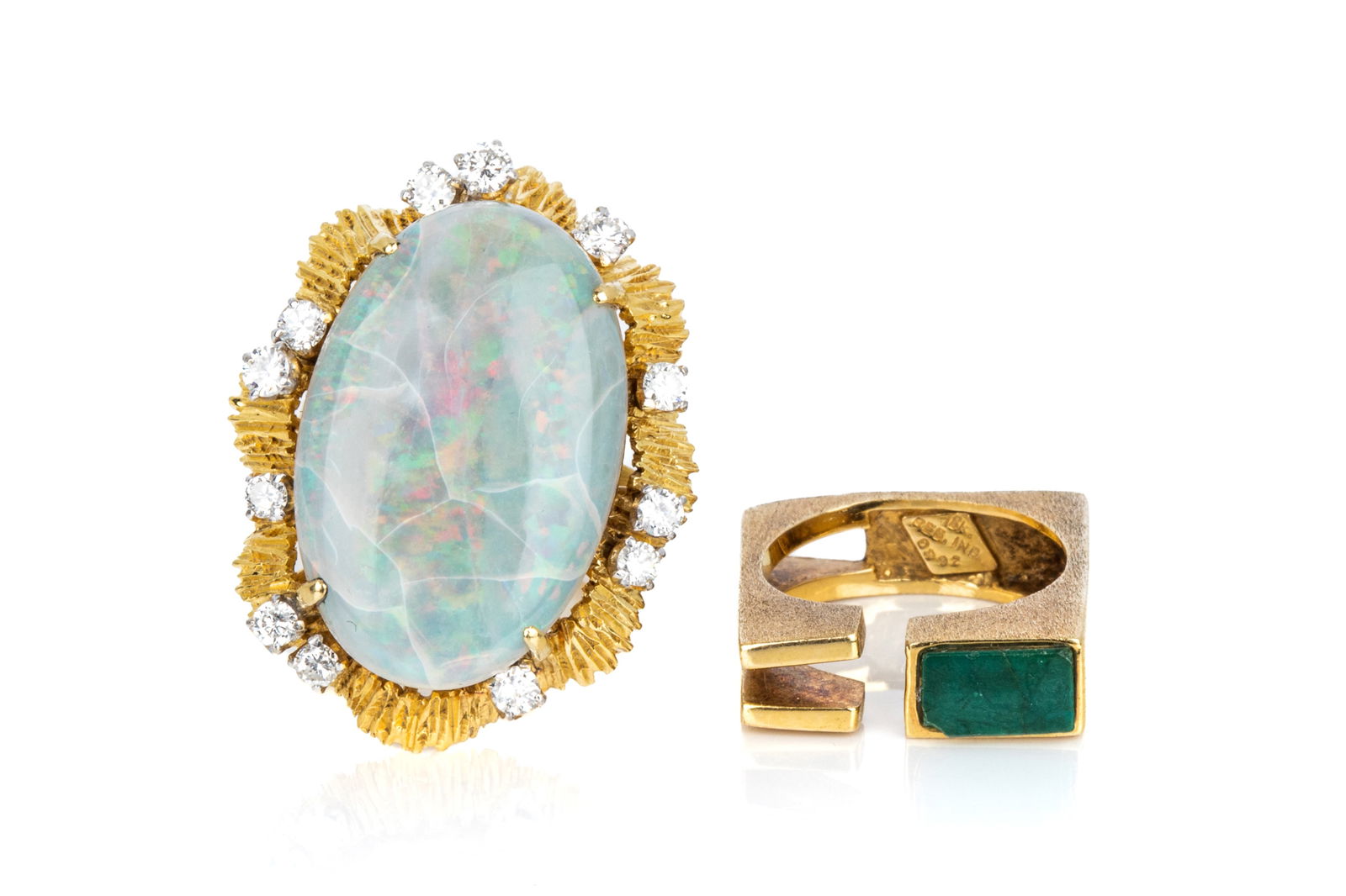 18K GOLD & GEMSTONE RING PAIRING 23.9g: 18K yellow gold brutalist ring measuring 5.6mm wide, featuring green gemstone (cracked and chipped). Size 5.5 (approximate)7.4 grams 18K yellow gold diamond and opal cluster ring measuring 31mm long.