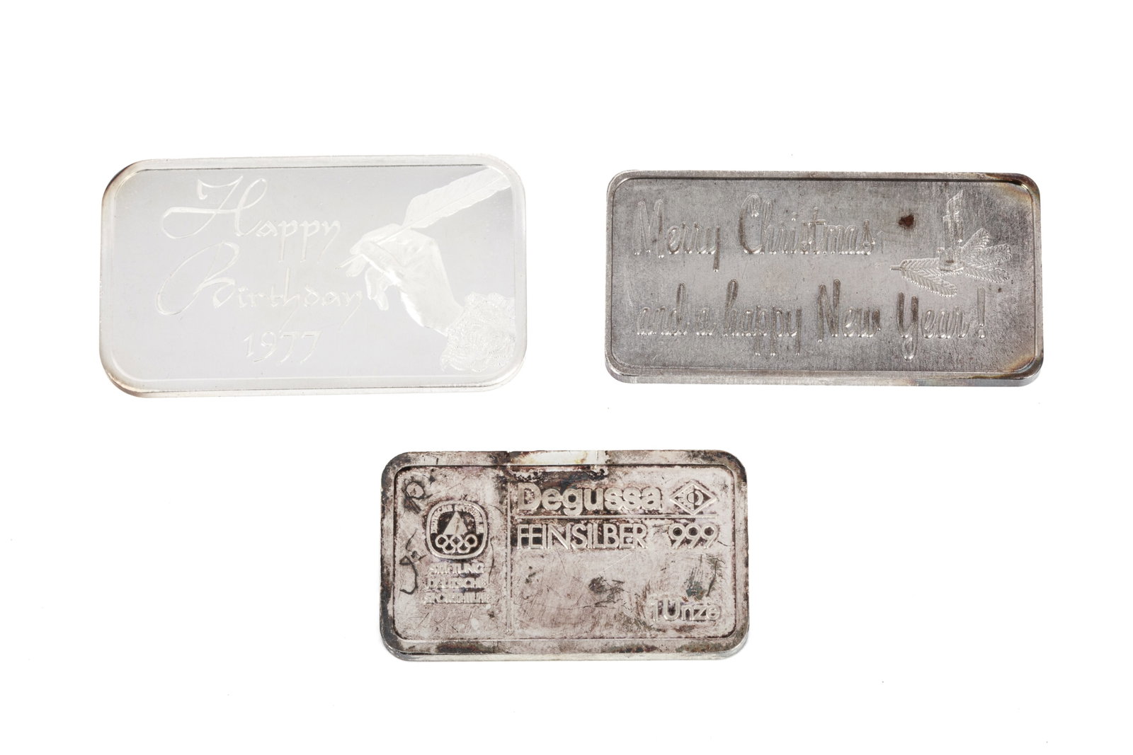 3 FINE SILVER BARS 93.8g: 2 Madison Mint 1 ounce silver bars: 1 reading Merry Christmas and a happy New Year! on the front face, and one ounce 999.0 fine silver minted in USA on the reverse.1 reading Happy Birthday 1977 on the